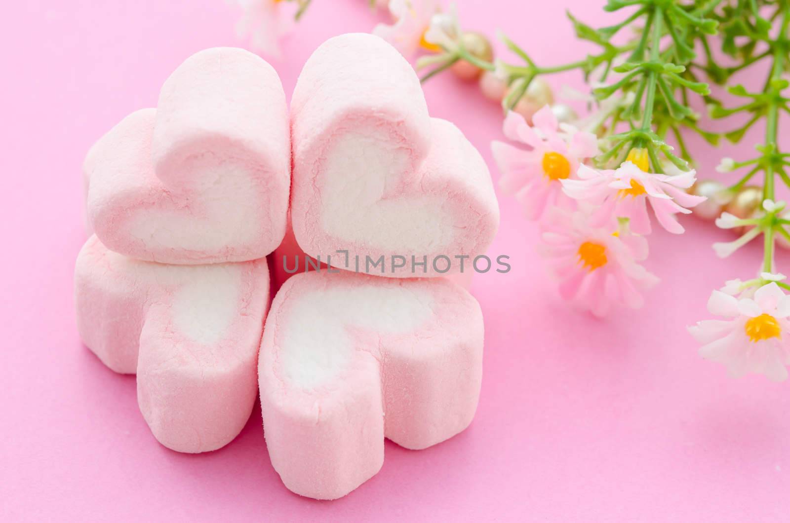 Pink marshmallows heart shape. by Gamjai