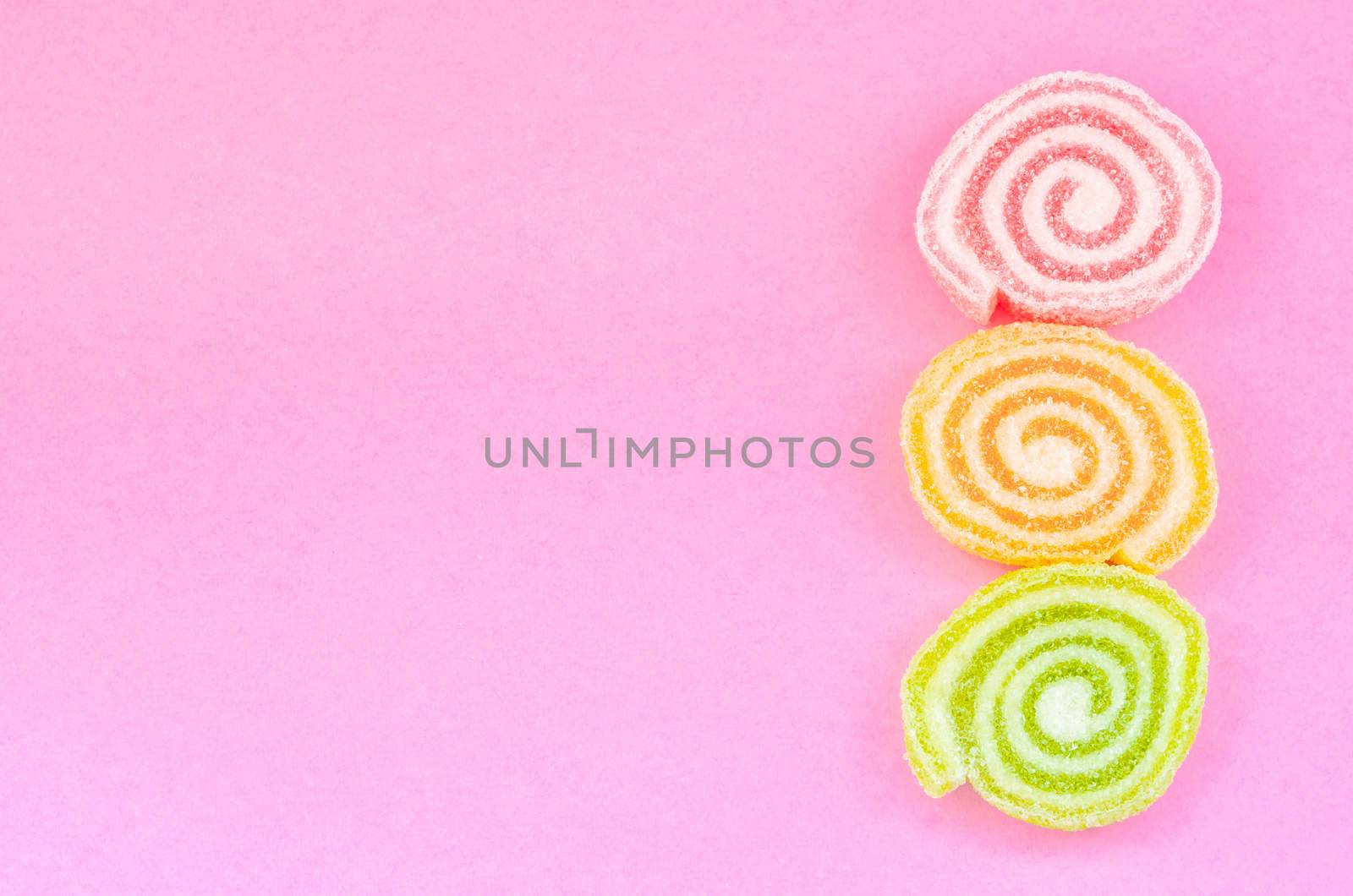 Jelly sweet, flavor fruit, candy dessert colorful with copy space on pink background.