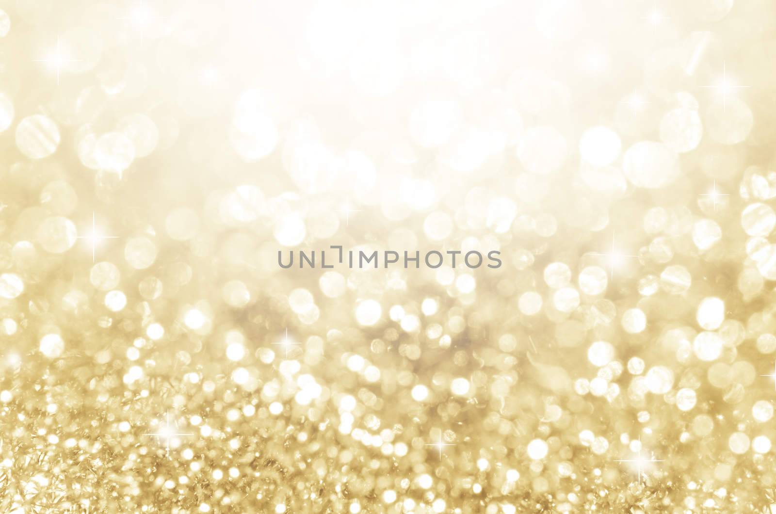 Lights on gold with star bokeh abstract as background.