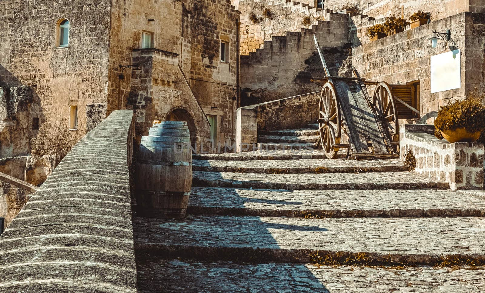 old historical scene with wood wagon and wine barrels typical tool used in Matera in the past, old style by donfiore