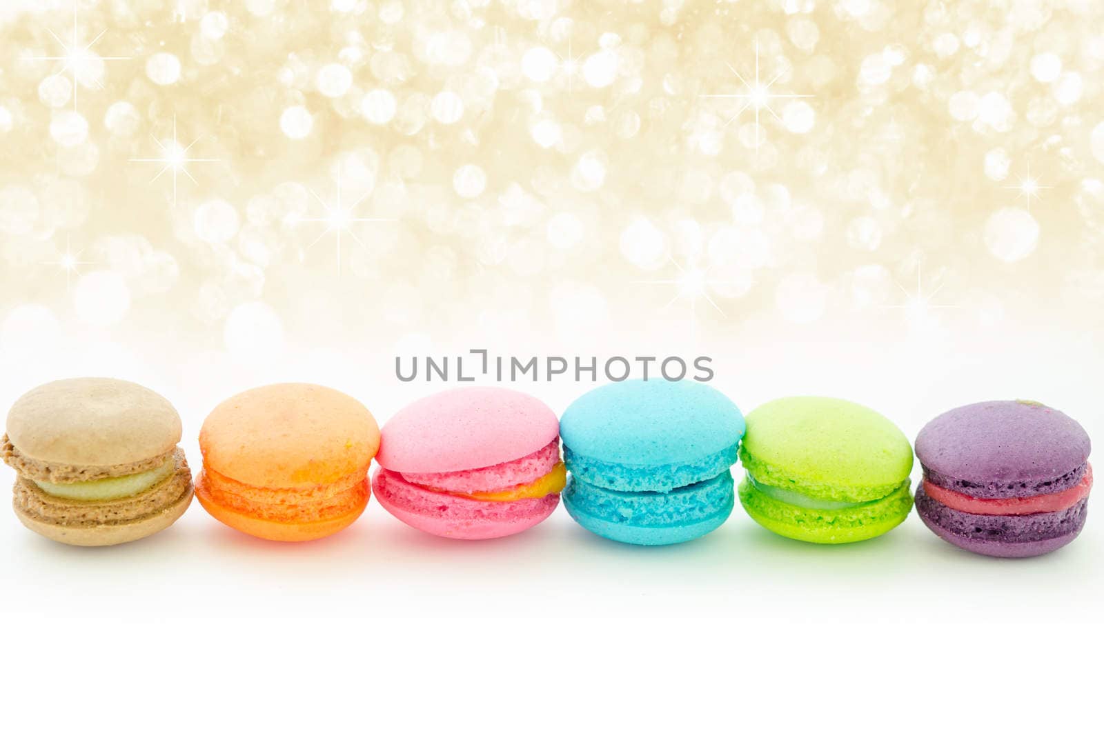 Colorful macaroons on white with beautiful abstract bokeh light.