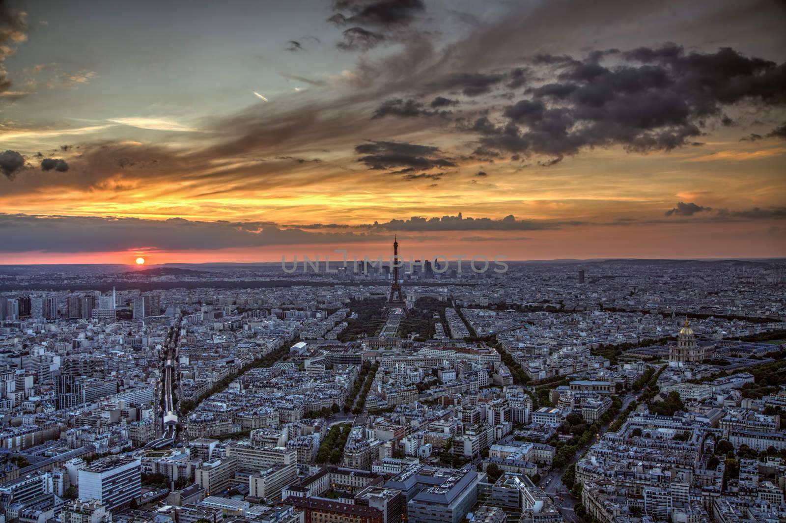 Sunset over Paris with dark Eiffel Tower viewed from Montparnasse tower on summer evening