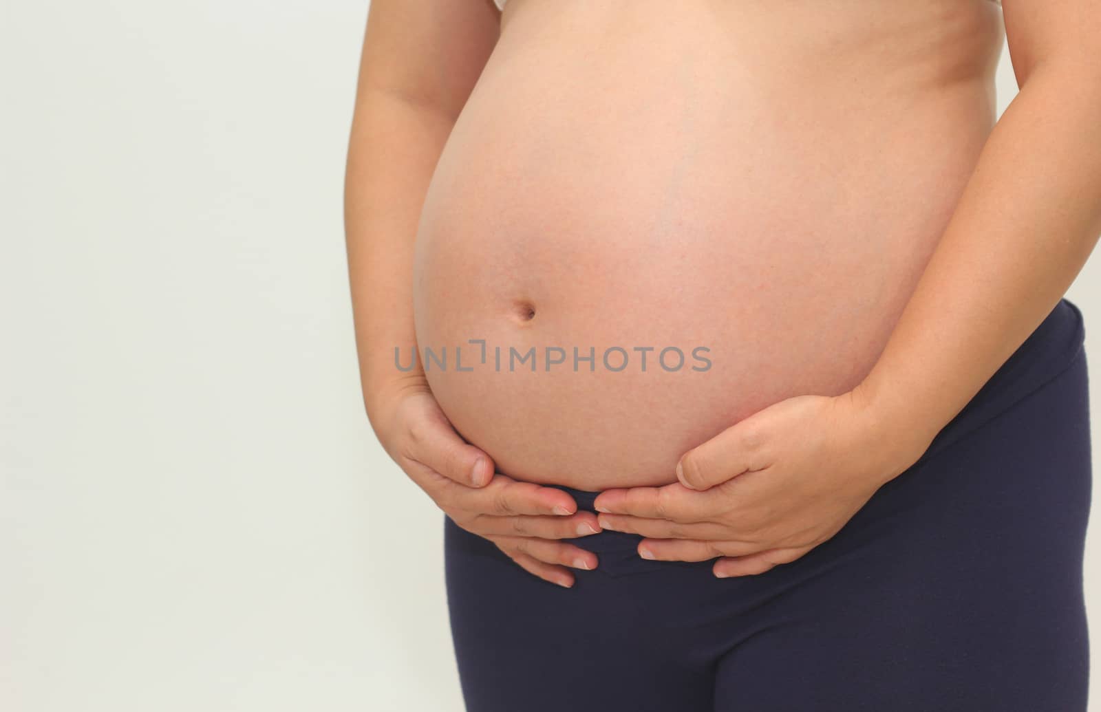 Photo of a cute pregnant woman belly