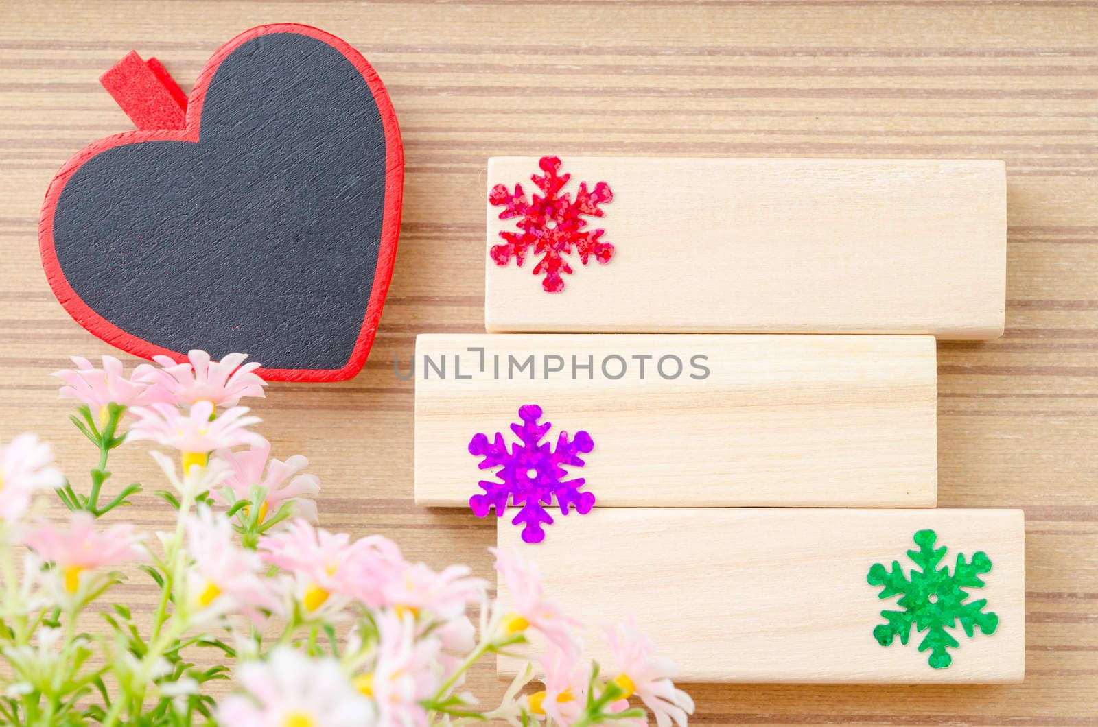 Blank wooden tag red heart shape and blank wooden tag with flower for your text on wooden background.