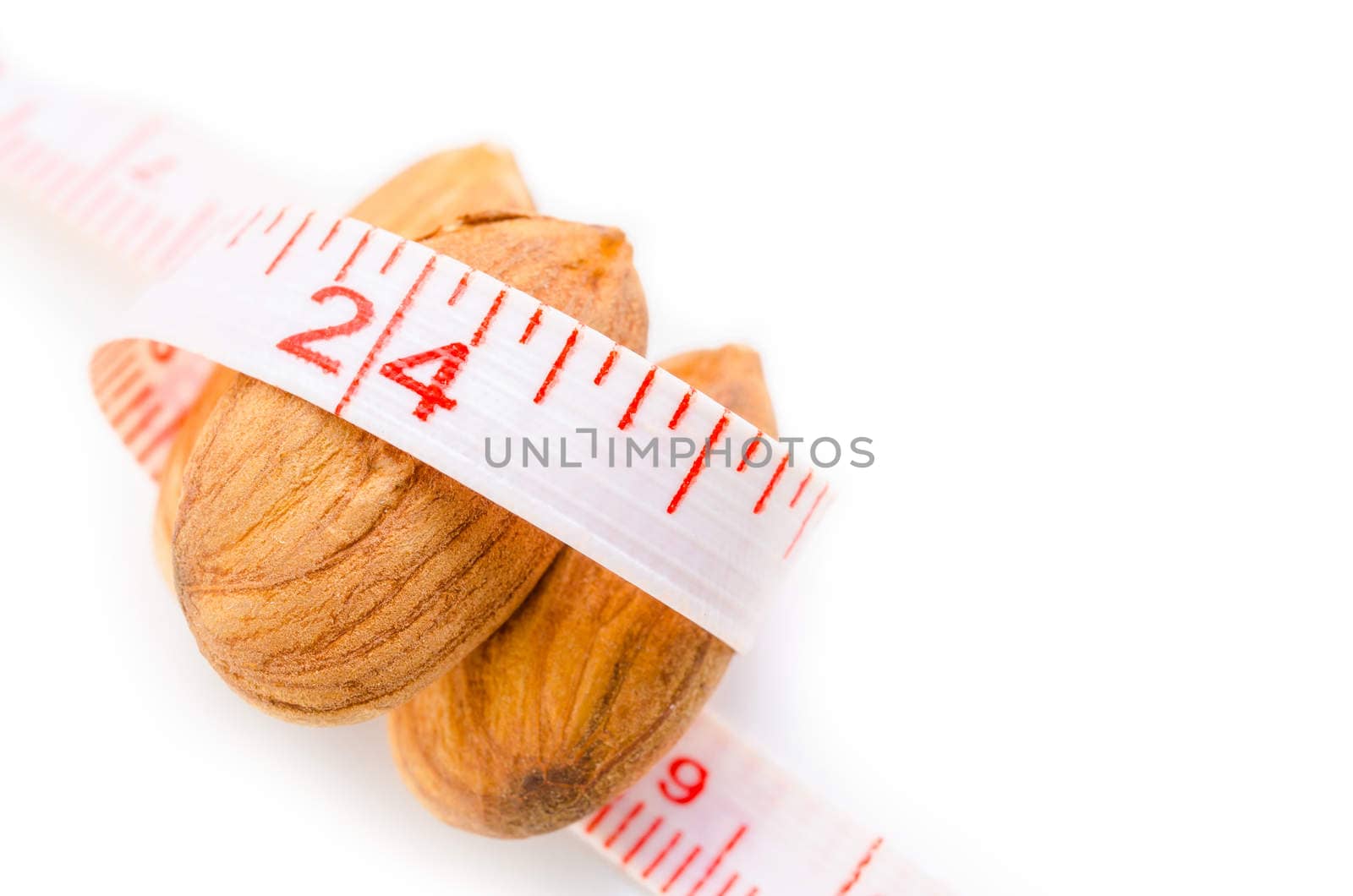 Almond nut and measure tape. by Gamjai