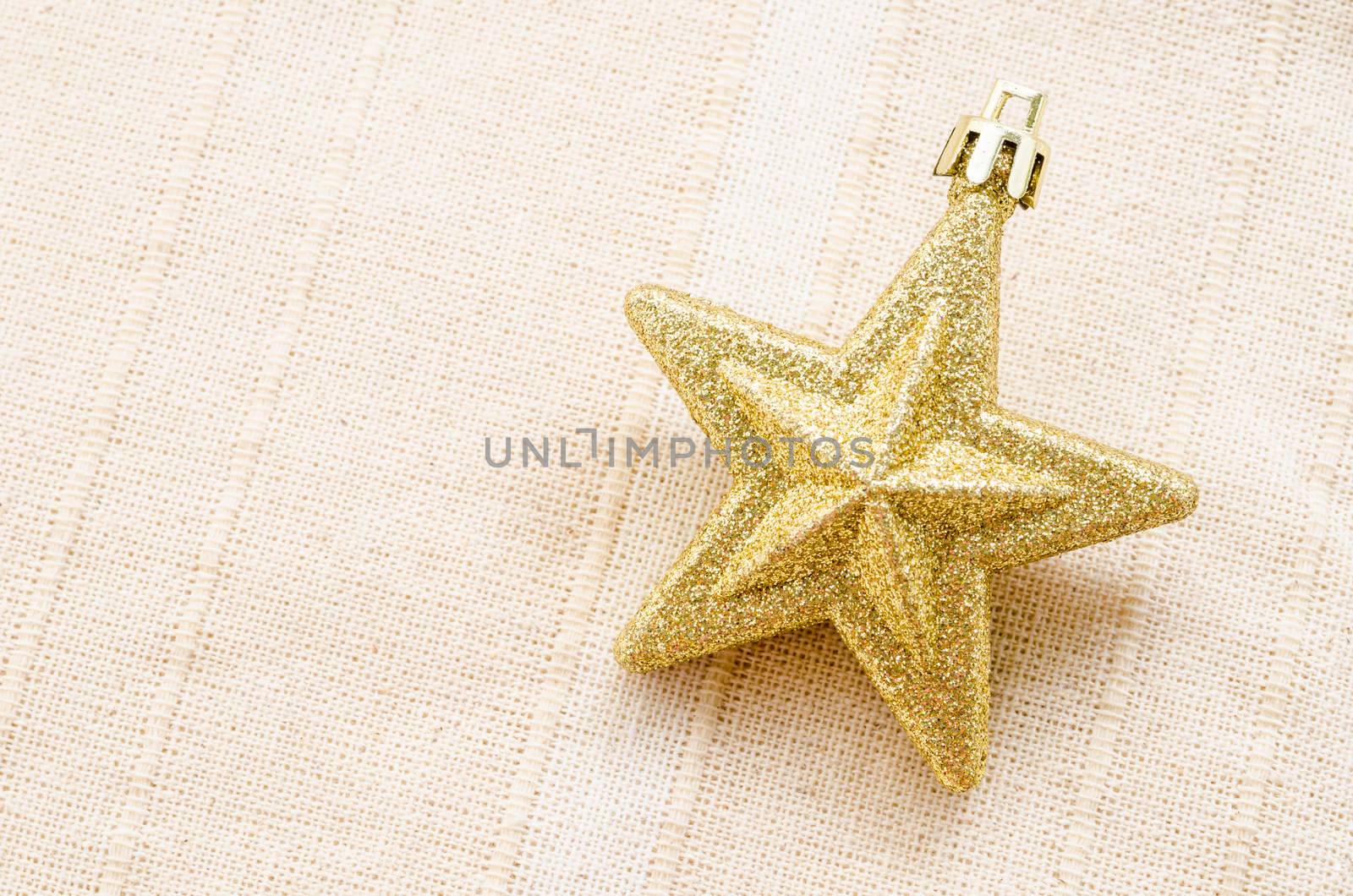 Gold five pointed star christmas decoration. by Gamjai