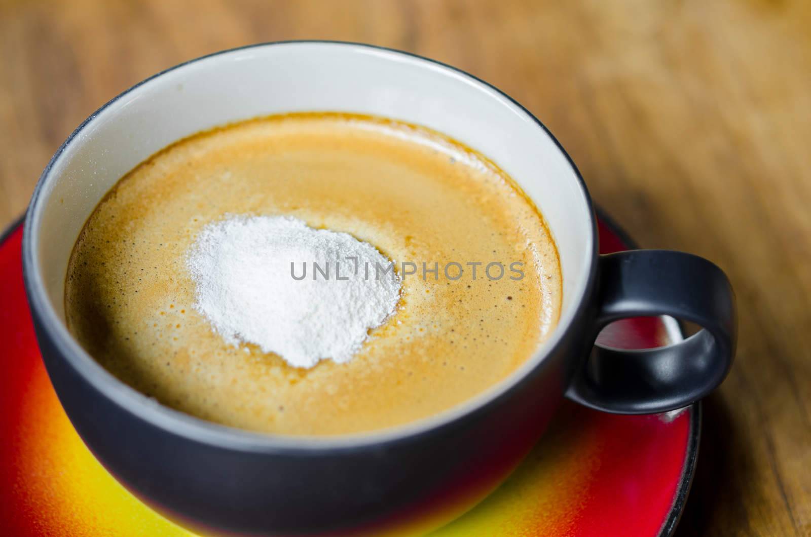 Creamer on a cup of coffee by Gamjai