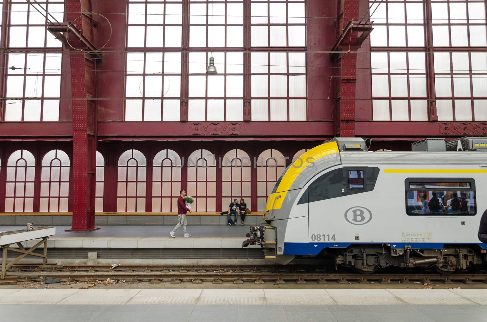 Antwerp, Belgium - May 11, 2015: People in Antwerp Central station on May 11, 2015 in Antwerp, Belgium. The station is now widely regarded as the finest example of railway architecture in Belgium.