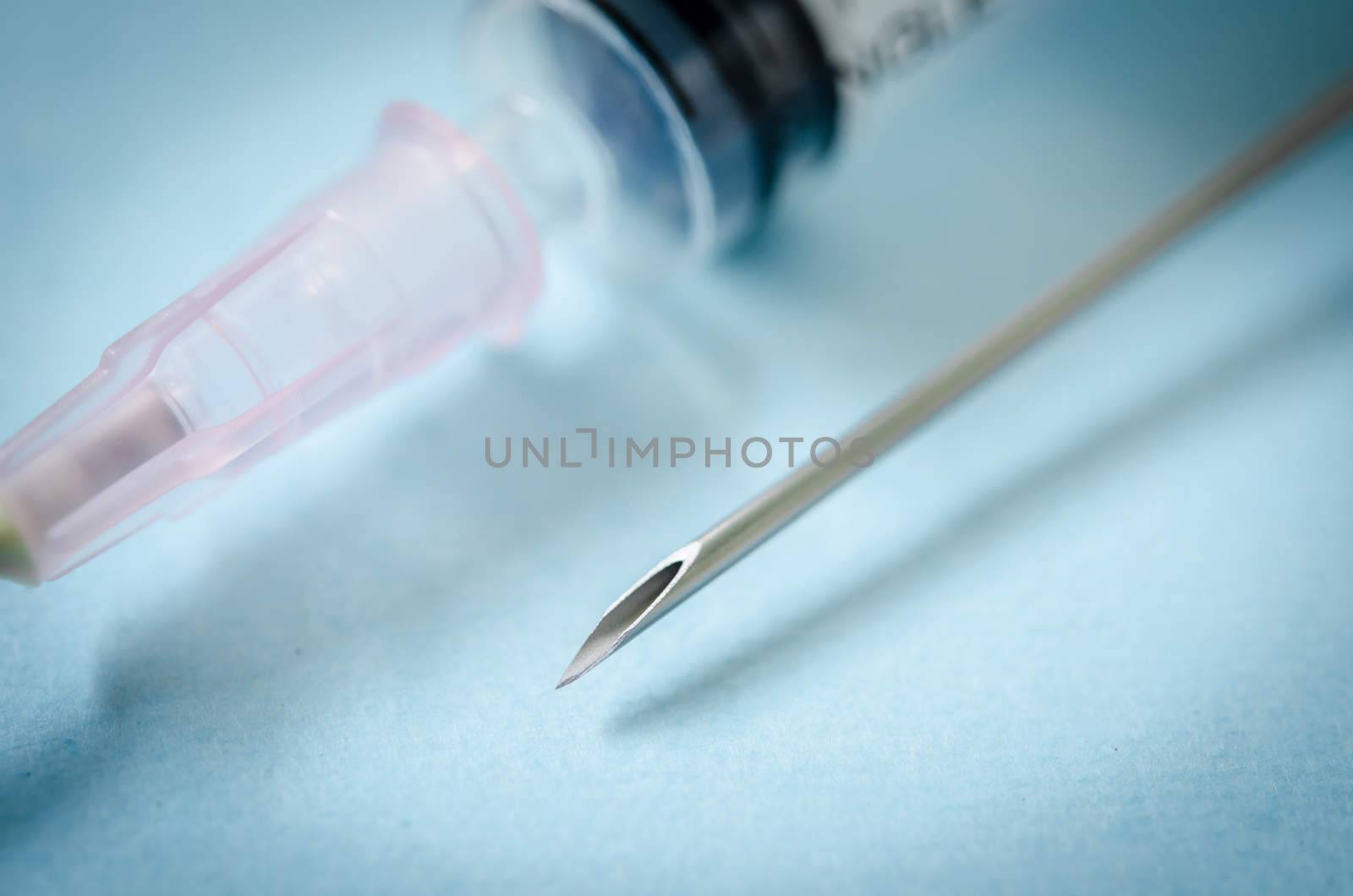 Close up needle syringe medical in laboratory.