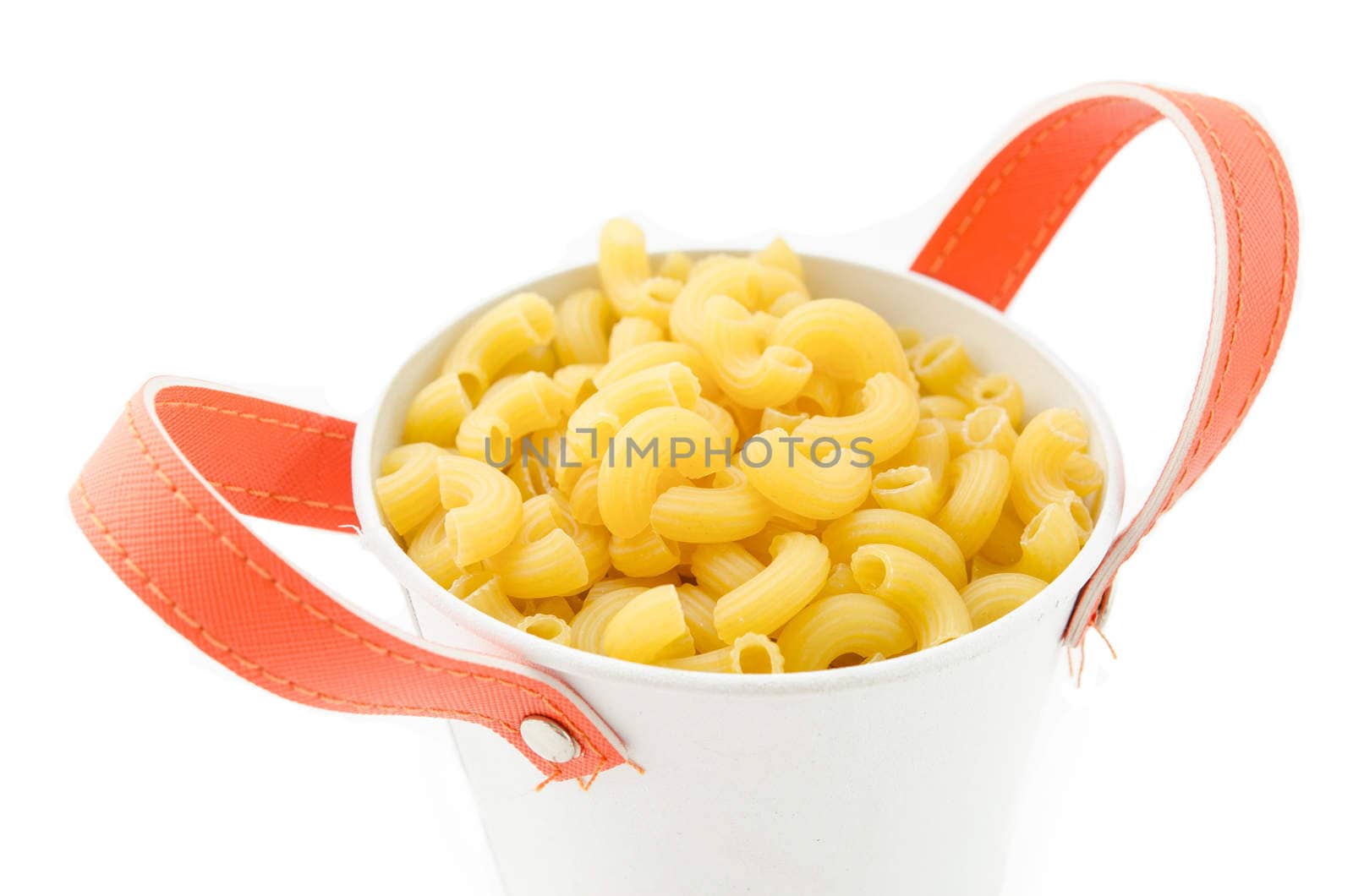 Raw dry elbow macaroni. Italian Pasta raw food in white bowl on white background.