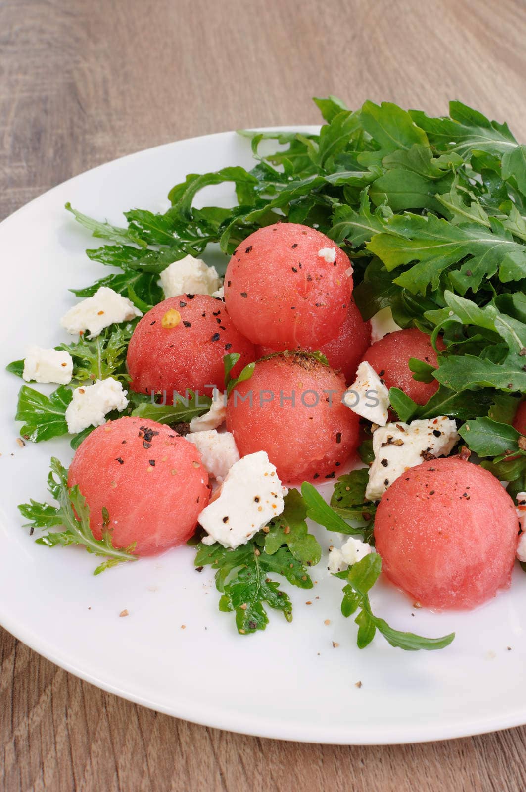 Watermelon salad with arugula and feta by Apolonia