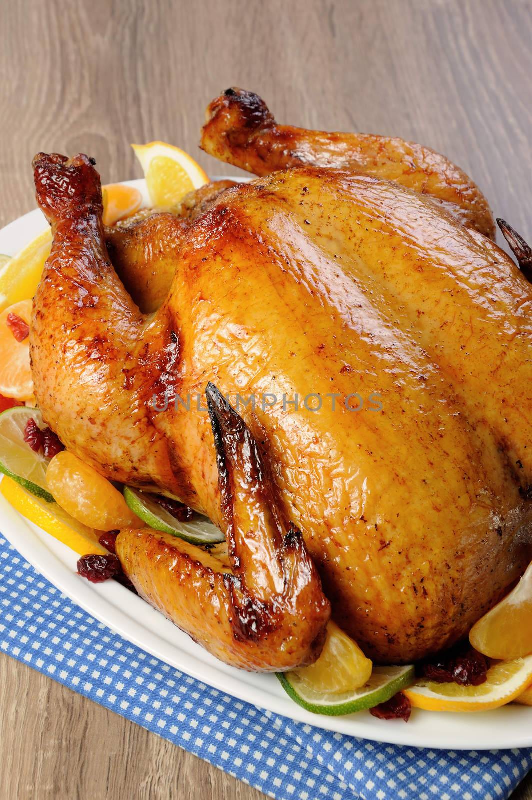 Baked chicken in orange, lime, tangerine and cranberry