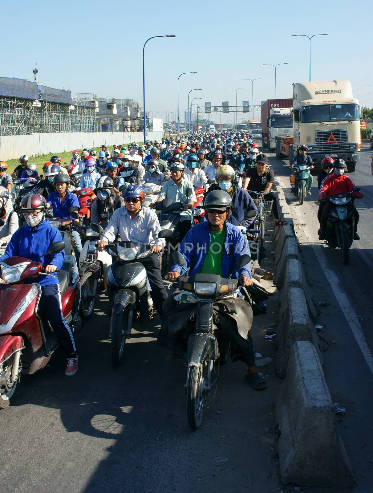 HO CHI MINH CITY, VIET NAM- NOV 19: Crowded situation on rush hour of Asian city, motorbikes in traffic jam, development make pressure on infrastucture, dusty, CO2, exhaust fumes, Vietnam, Nov19, 2015