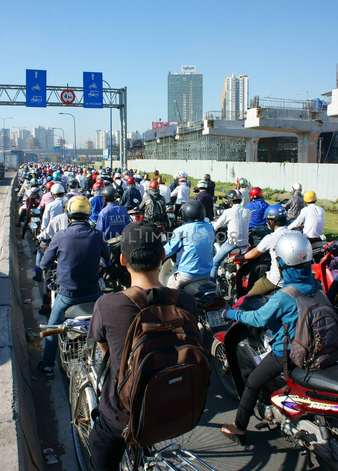 HO CHI MINH CITY, VIET NAM- NOV 19: Crowded situation on rush hour of Asian city, motorbikes in traffic jam, development make pressure on infrastucture, dusty, CO2, exhaust fumes, Vietnam, Nov19, 2015