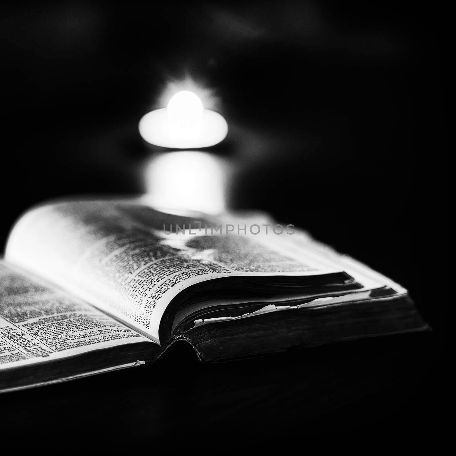 Bible with candles by artistrobd