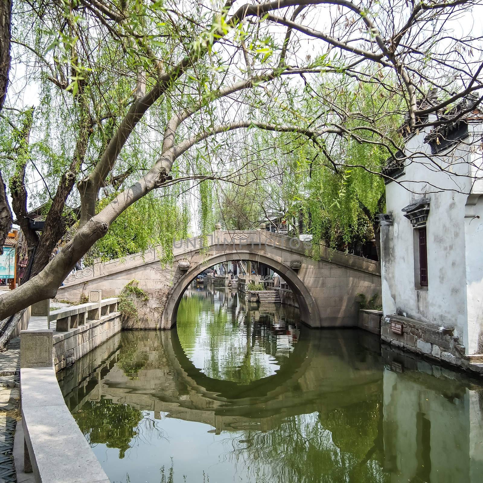 ZHOUZHUANG, SHANGHAI - April 11, 2011 : Zhouzhuang, the ancient water village is Shanghai tourist attraction with 1,000,000 visitors per year and there are a lot of variety activities have done here.