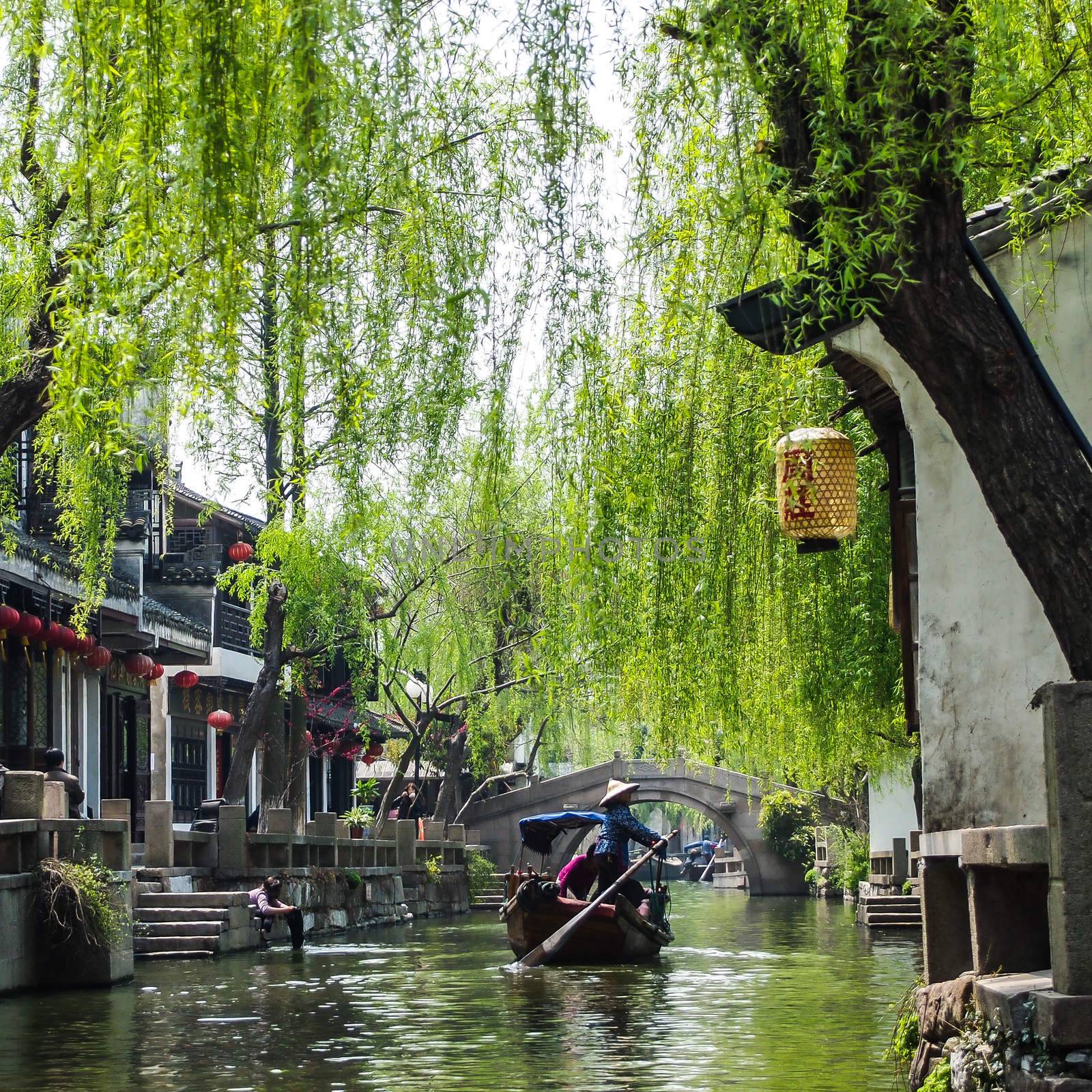 ZHOUZHUANG, SHANGHAI - April 11, 2011 : Zhouzhuang, the ancient water village is Shanghai tourist attraction with 1,000,000 visitors per year and there are a lot of variety activities have done here.