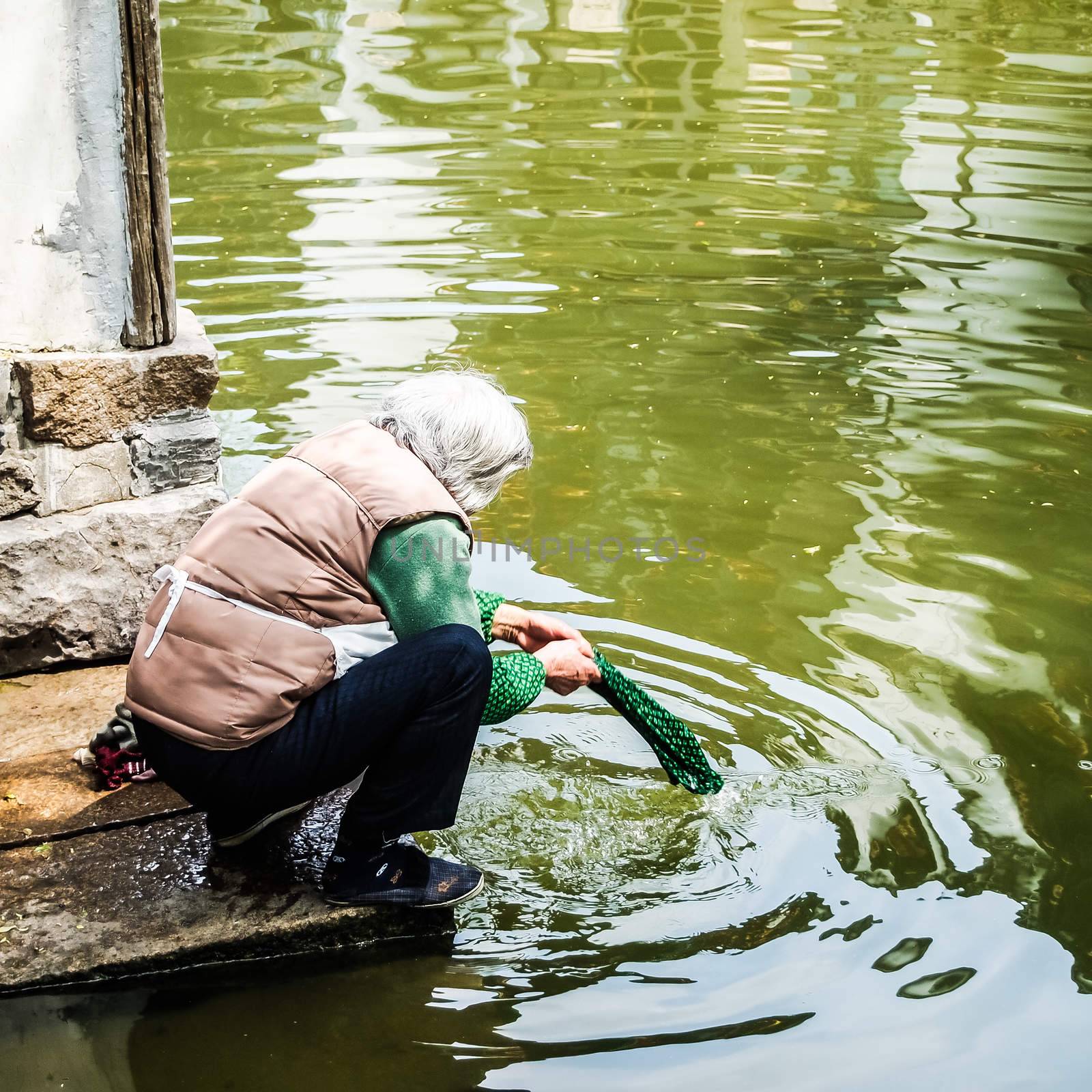 ZHOUZHUANG, SHANGHAI - April 11, 2011 : Zhouzhuang, the ancient water village is Shanghai tourist attraction with 1,000,000 visitors per year and there are a lot of variety activities have done here.