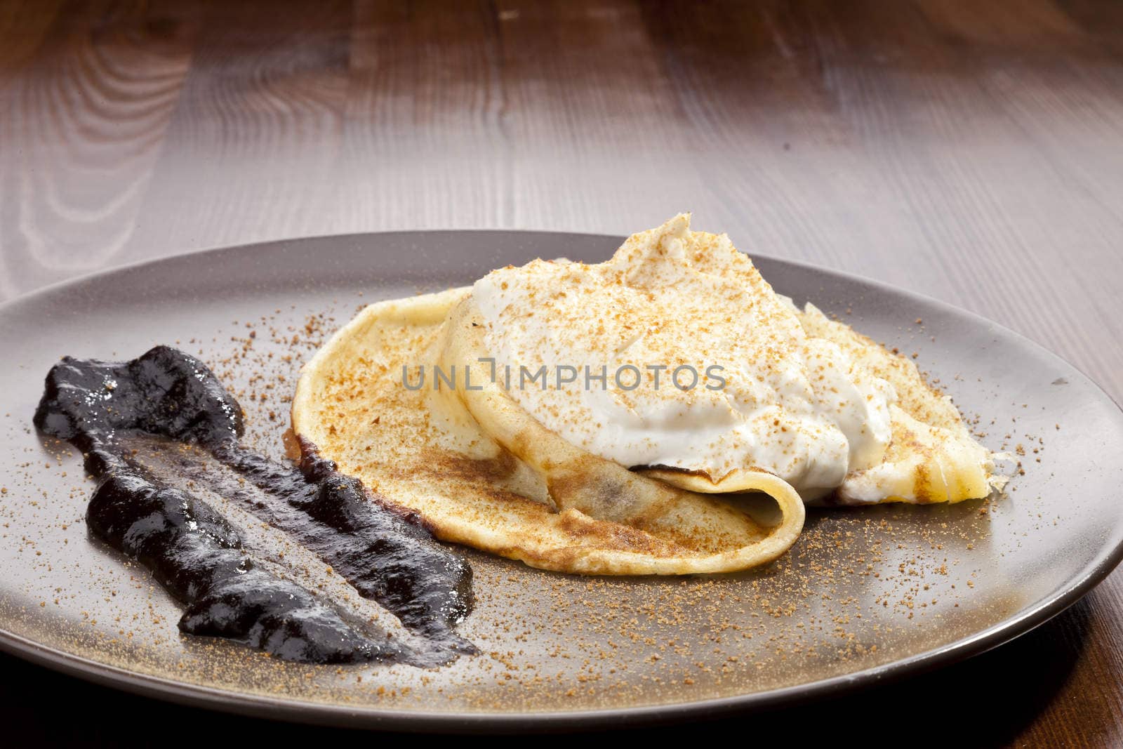 Crepe pancake with whipped cram and gingerbread powder