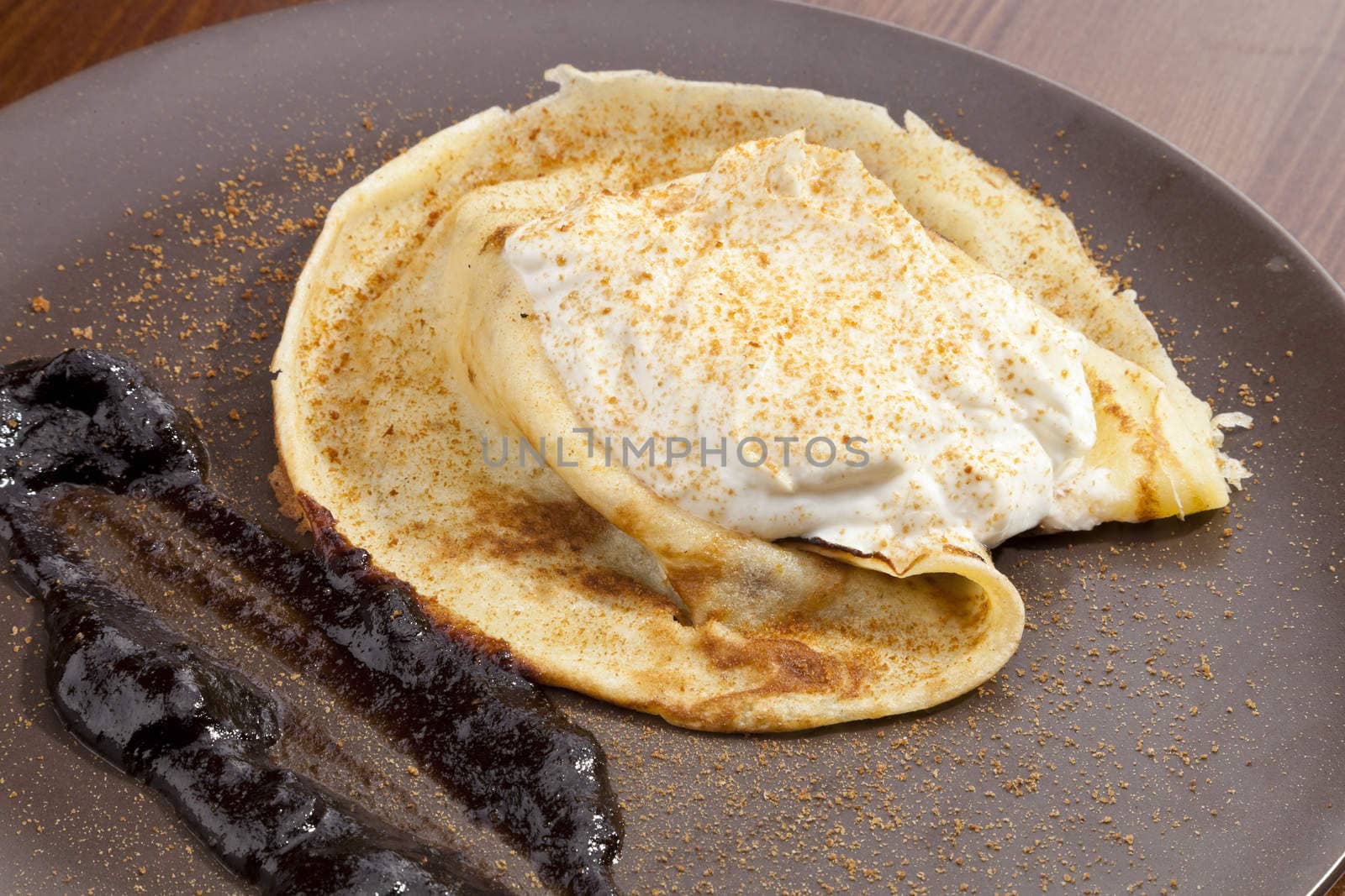 Crepe pancake with whipped cram and gingerbread powder