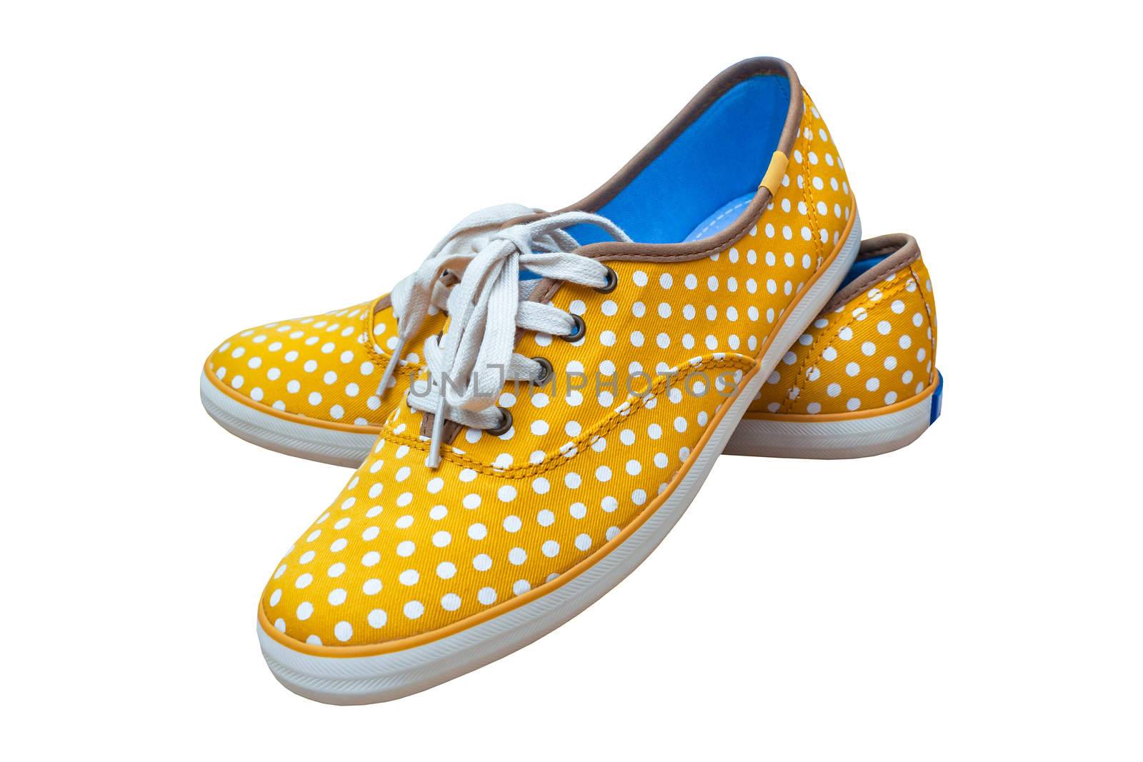 Pair sneakers, vintage dot yellow color  isolated on white backg by FrameAngel