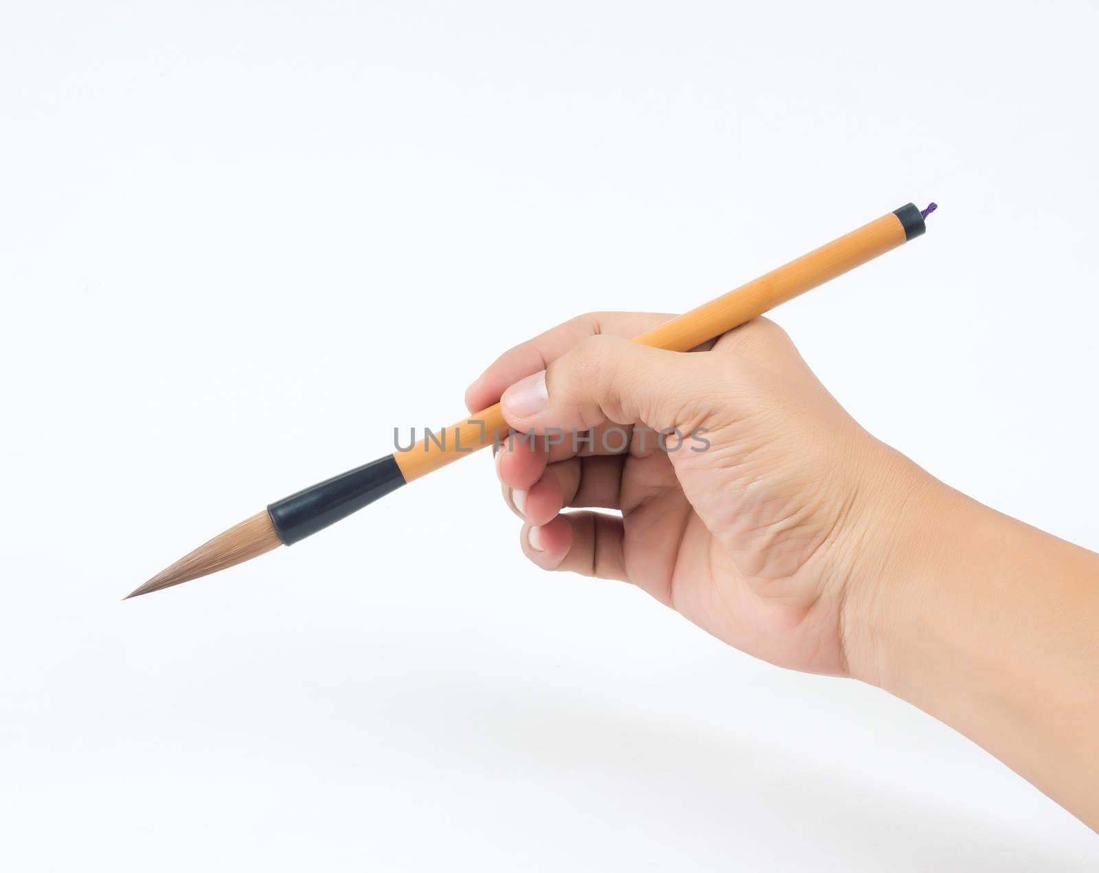 man hand and brown brush on white background