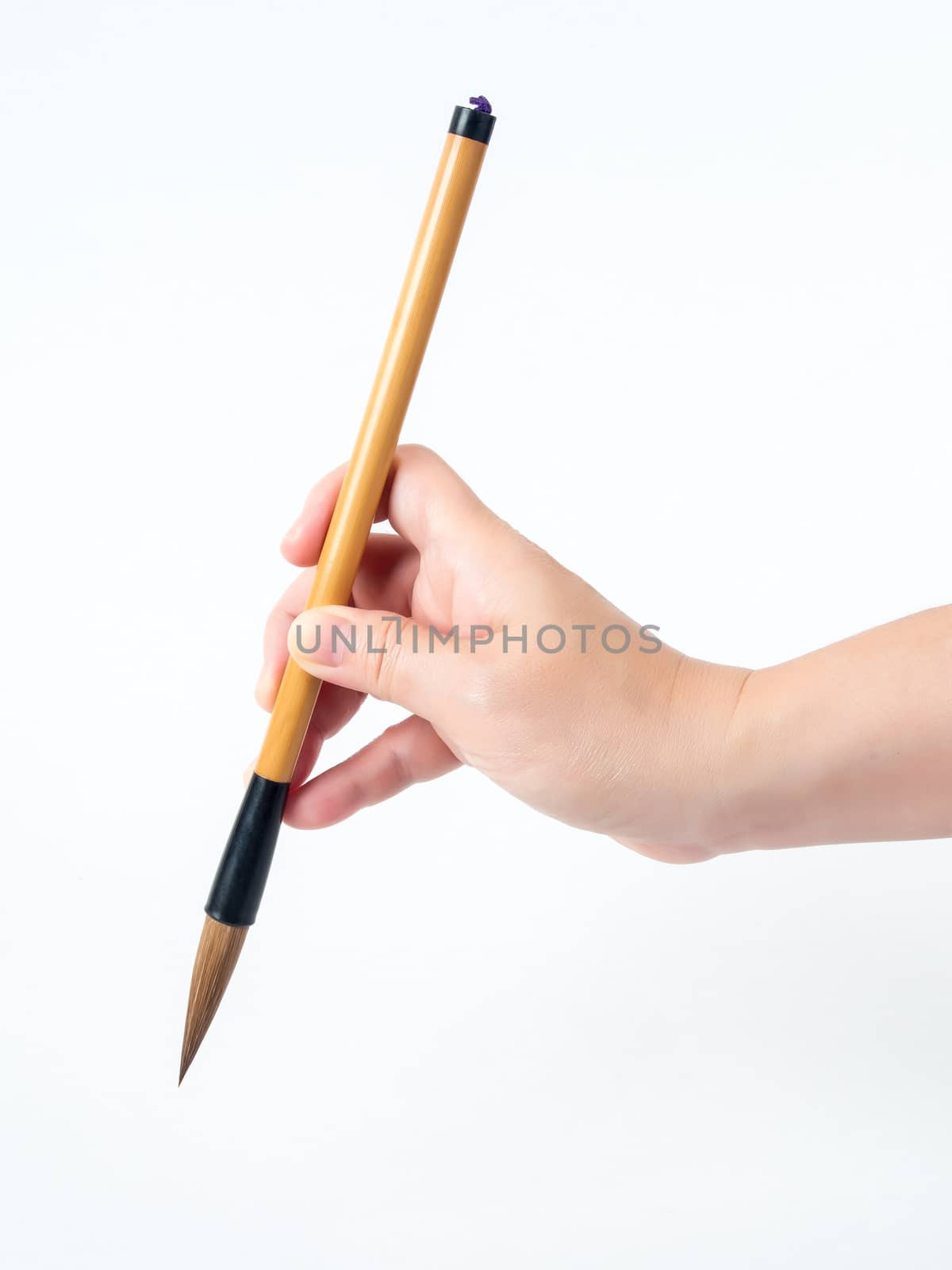 wooden brush in woman hand with white background