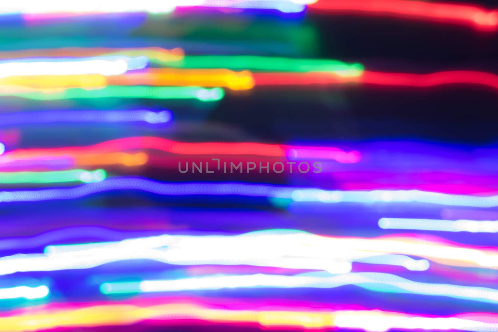 futuristic abstract glowing background resembling motion blurred neon light curves, abstract background