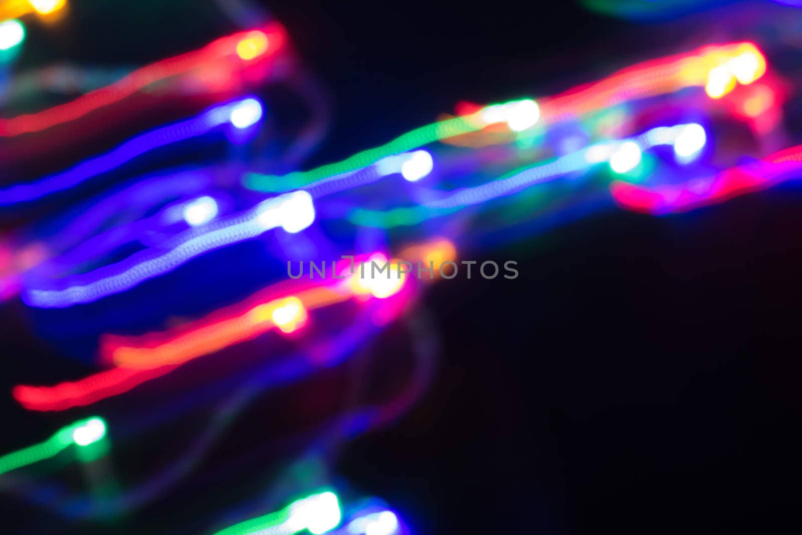 futuristic abstract glowing background resembling motion blurred neon light curves, abstract background