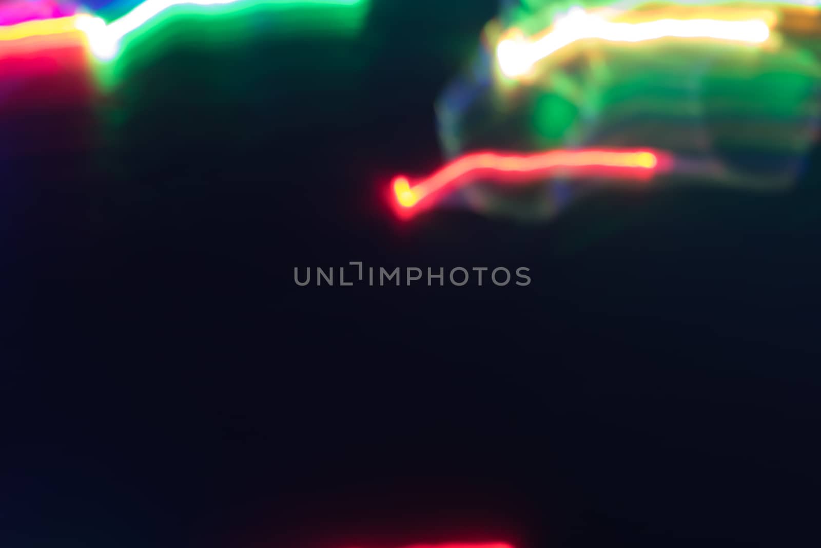 futuristic abstract glowing background resembling motion blurred neon light curves, abstract background