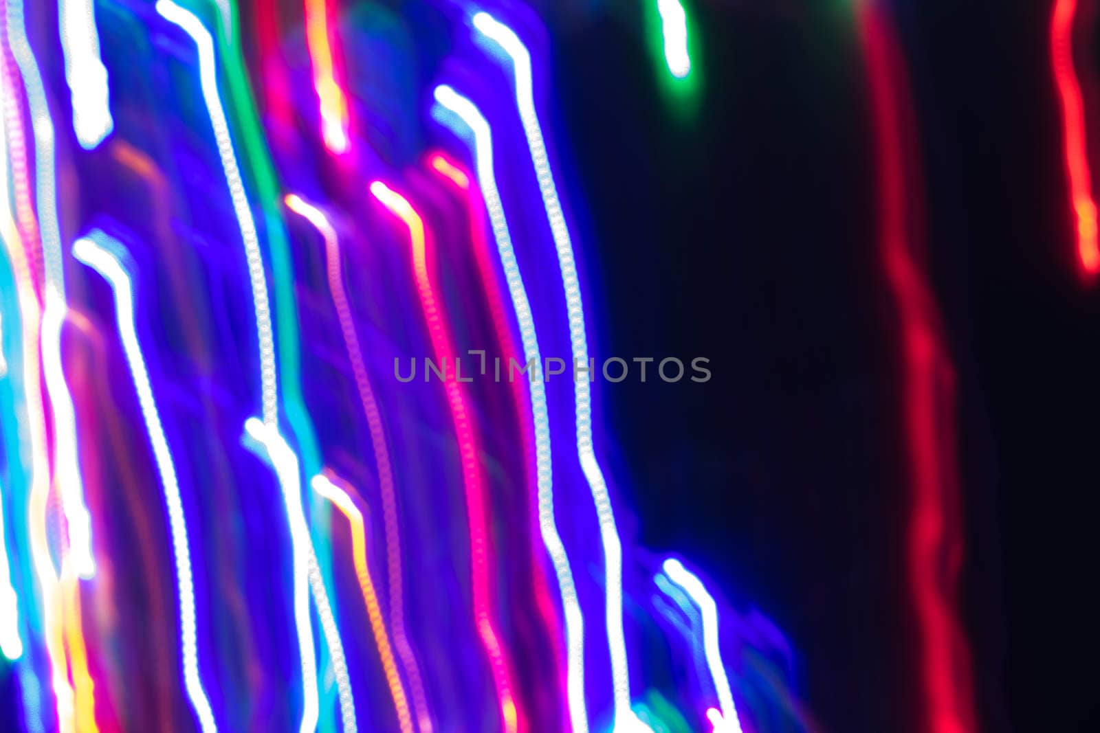 futuristic abstract glowing background resembling motion blurred neon light curves, abstract background