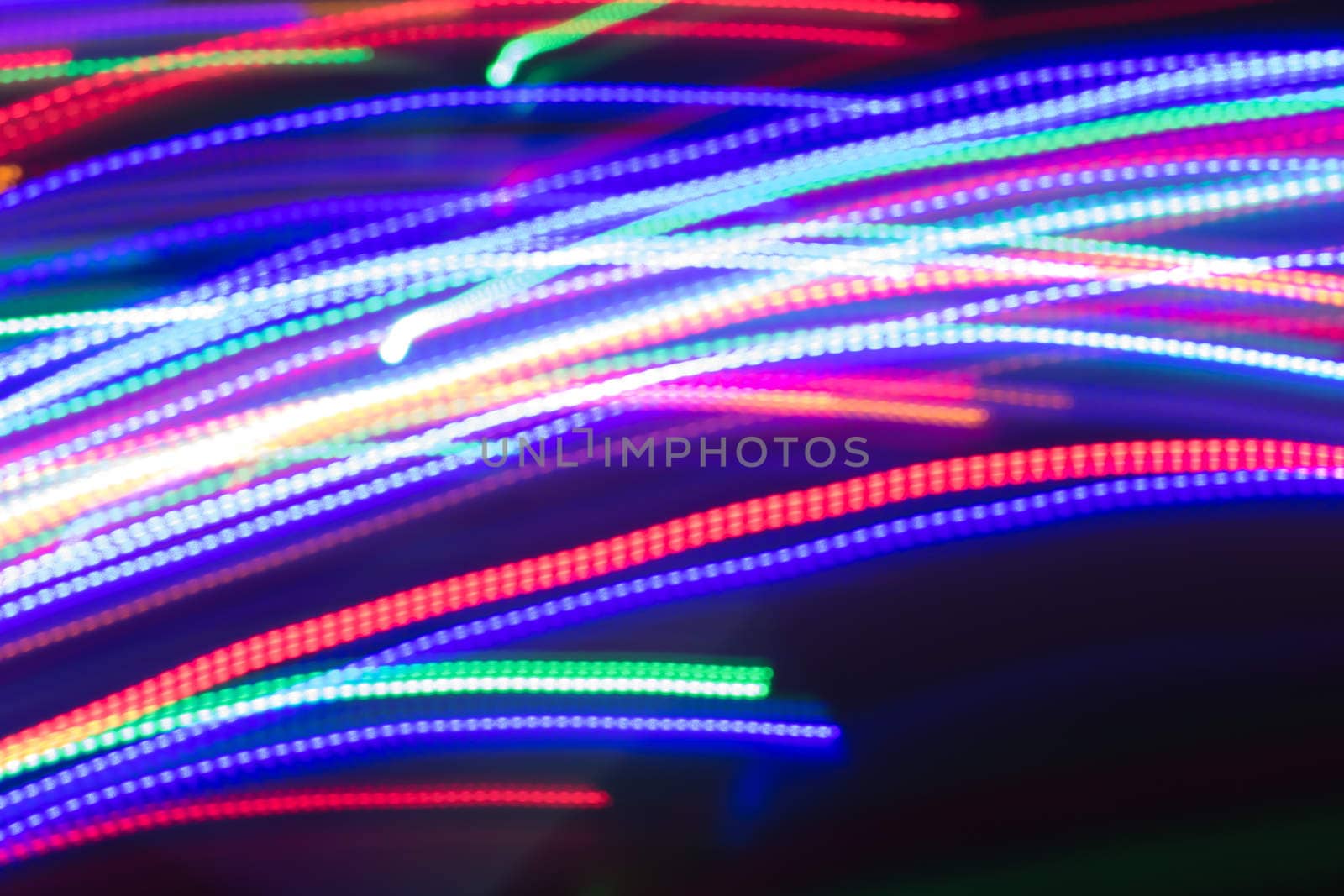 futuristic abstract glowing background resembling motion blurred neon light curves, abstract background