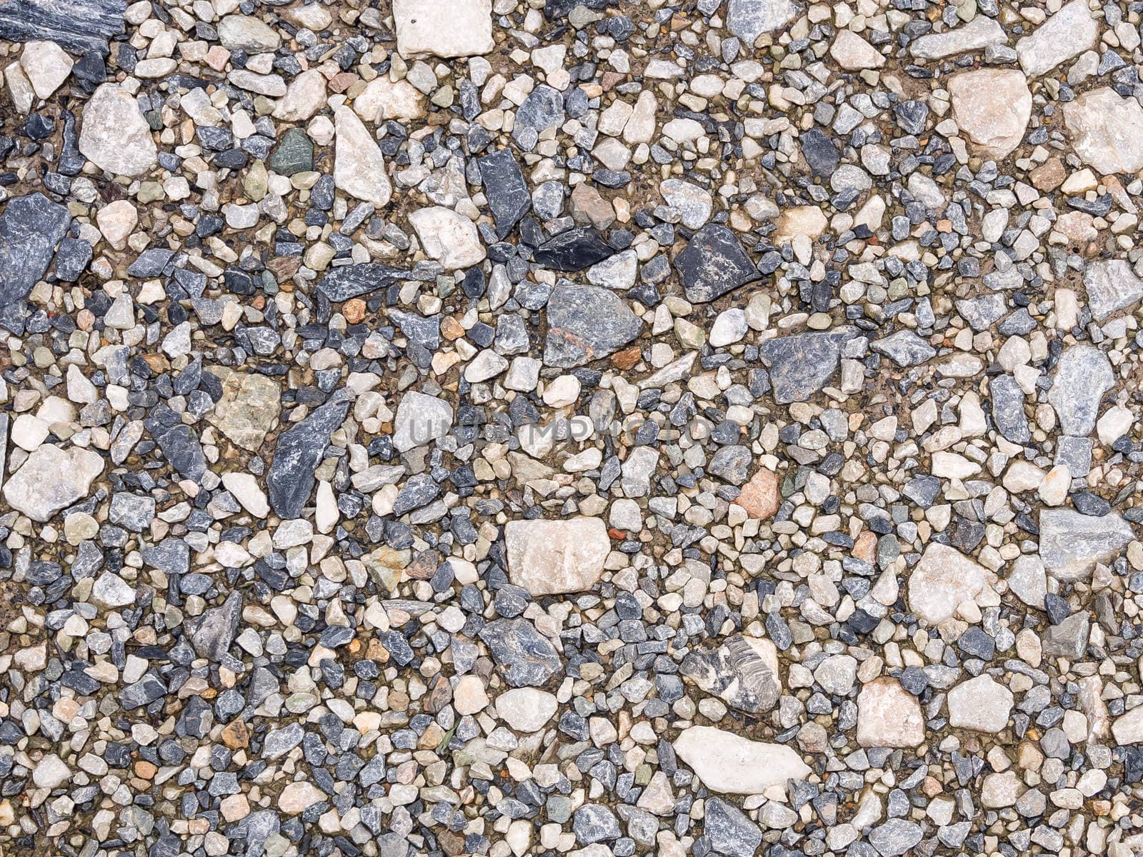 wet stones ground of parking area . use for background