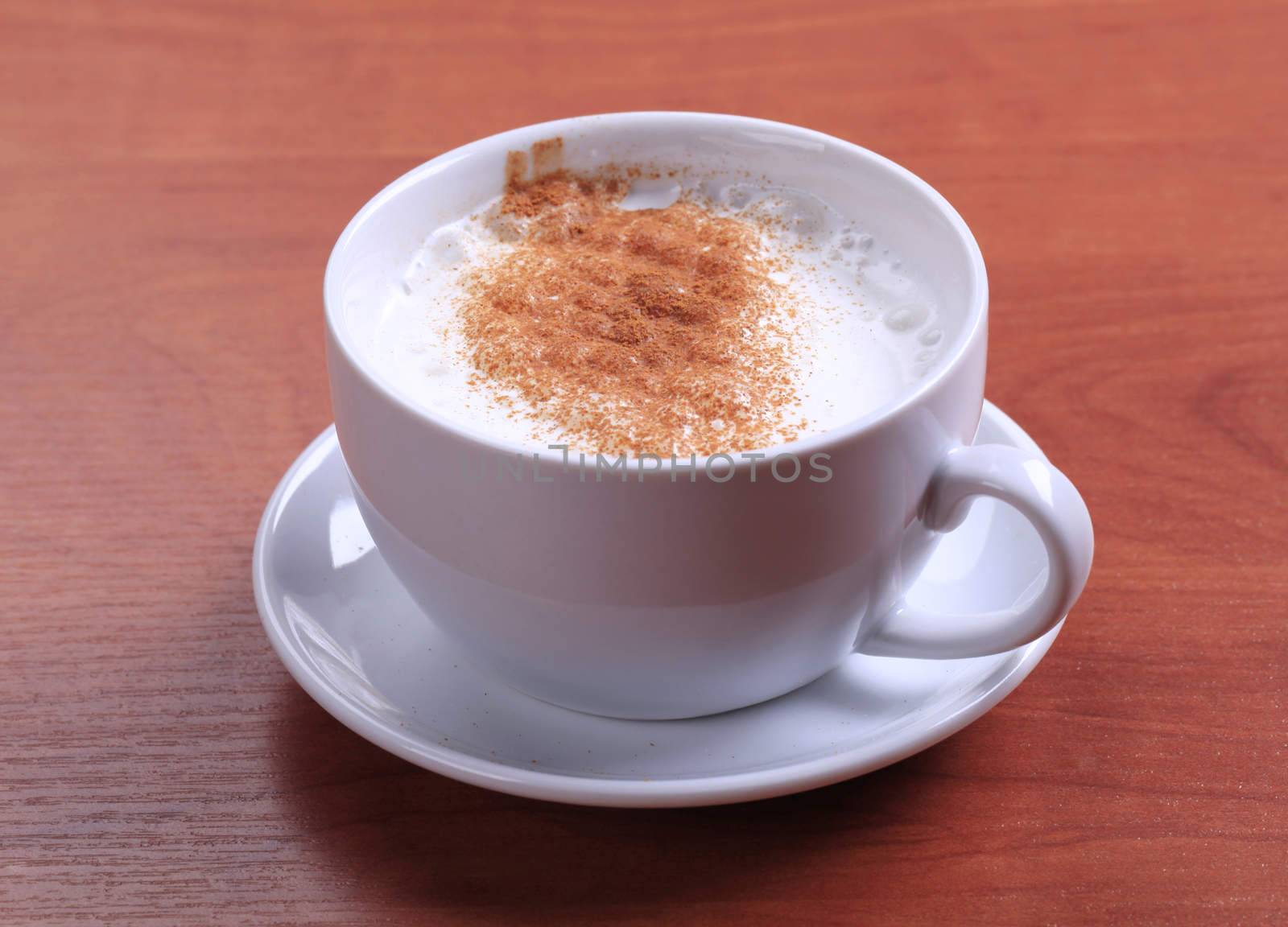 Cup of hot milk with nutmeg or cinnamon