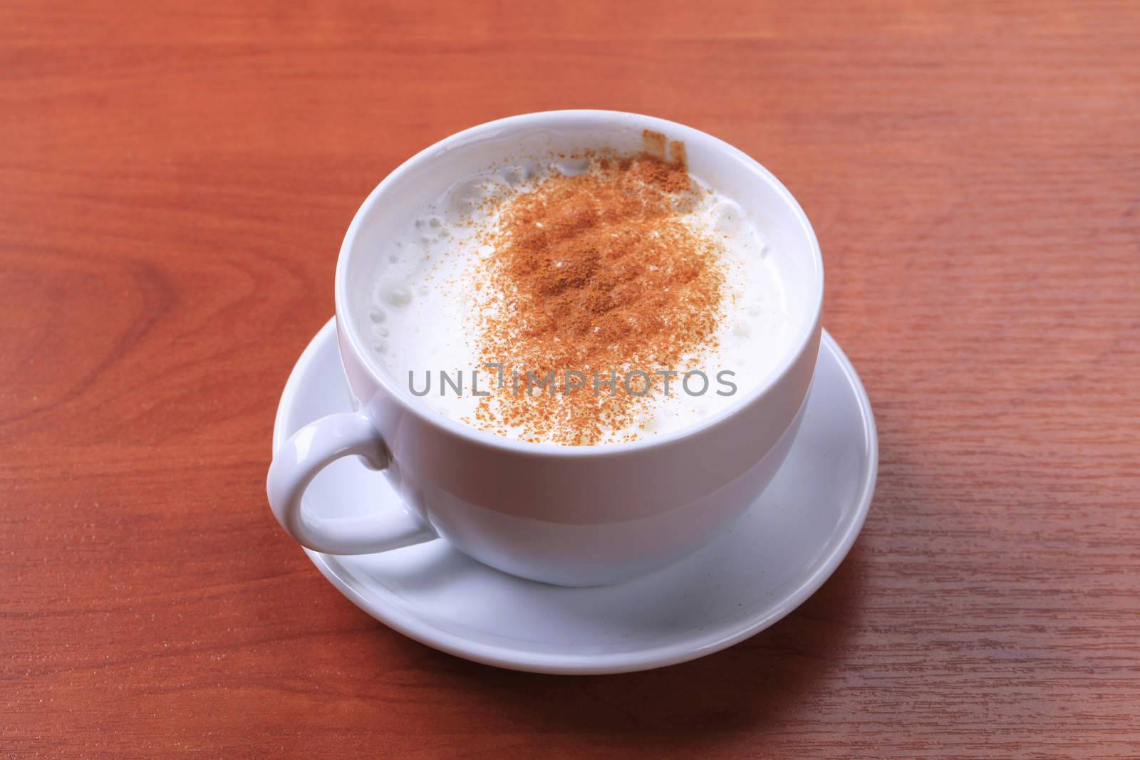 Cup of hot milk with nutmeg or cinnamon