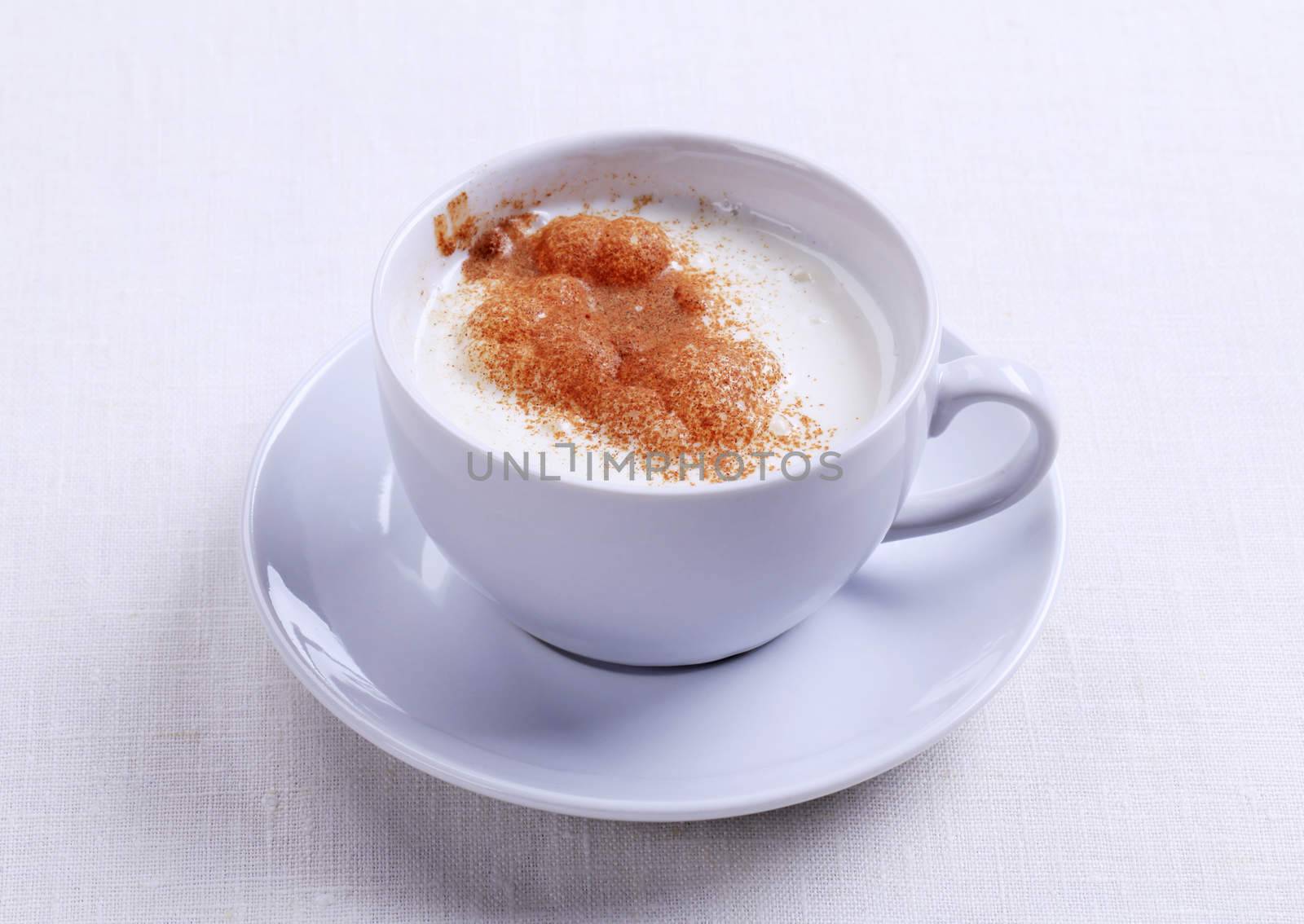 Vanilla steamer with a dusting of nutmeg or cinnamon