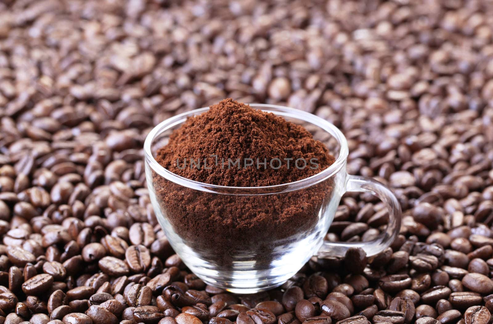 Freshly ground coffee in a glass cup 