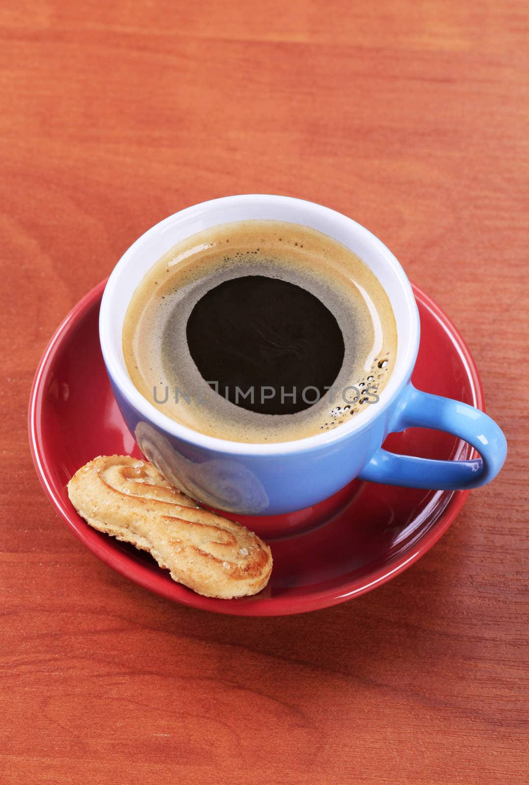 Cup of black coffee and biscuit