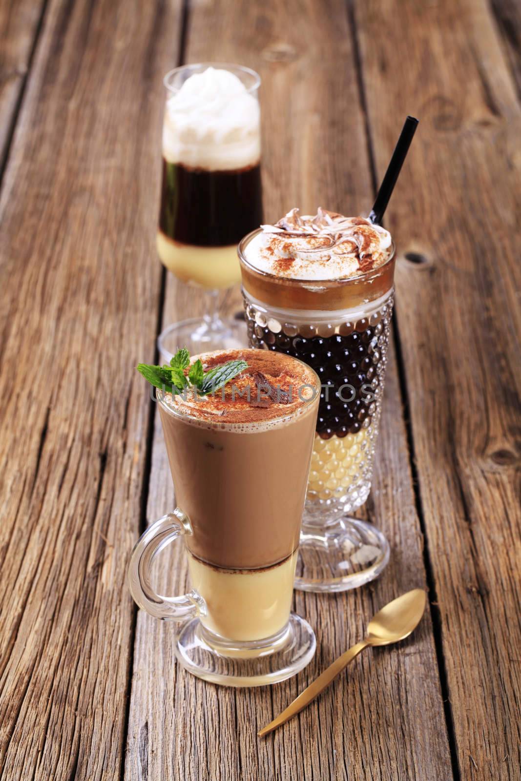 Coffee and chocolate drinks in tall glasses