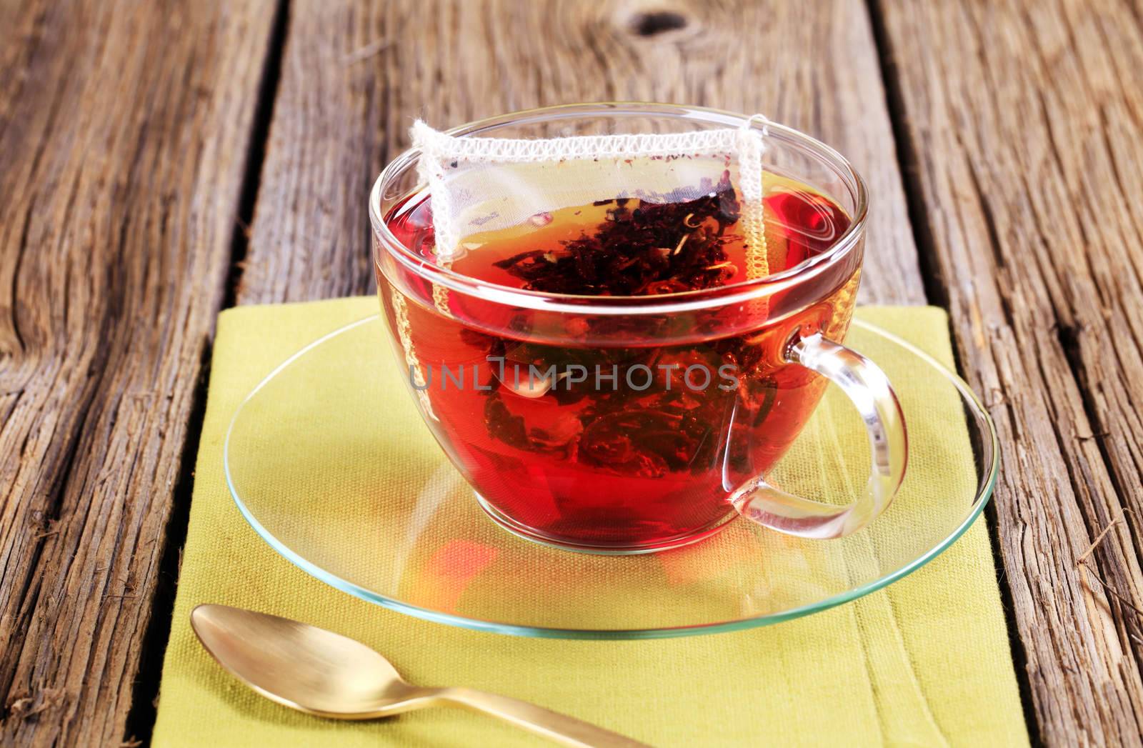 Fruit tea in a glass cup - closeup