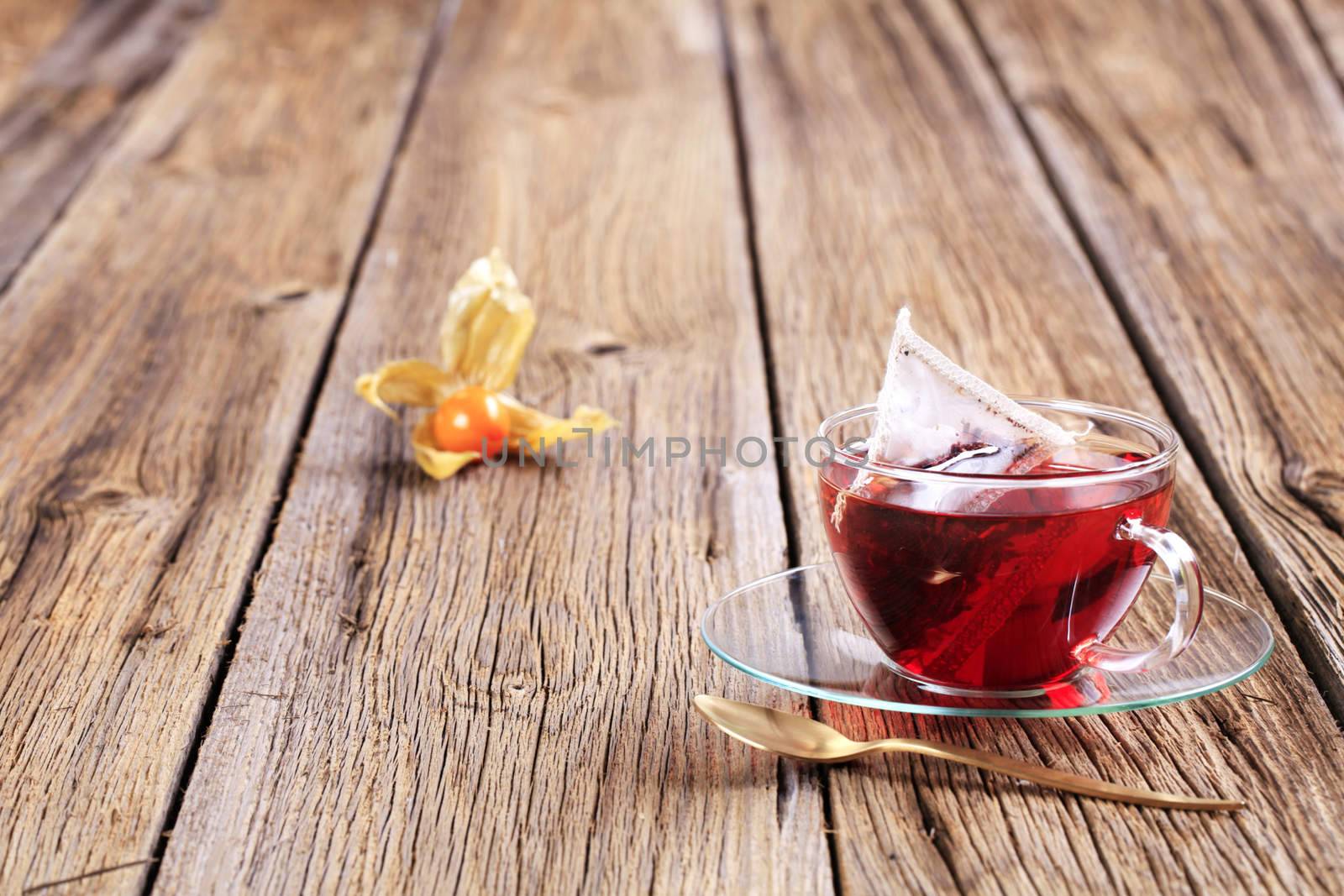 Fruit tea in a glass cup - closeup