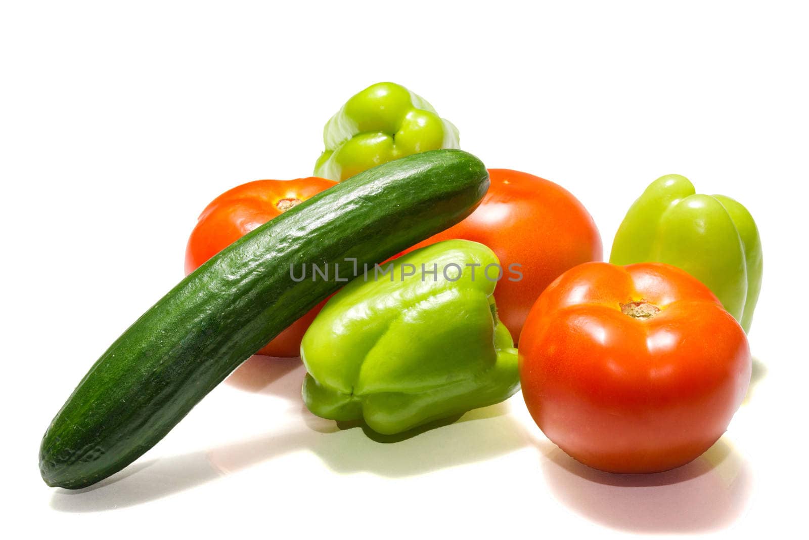 The photo shows vegetables on a white background