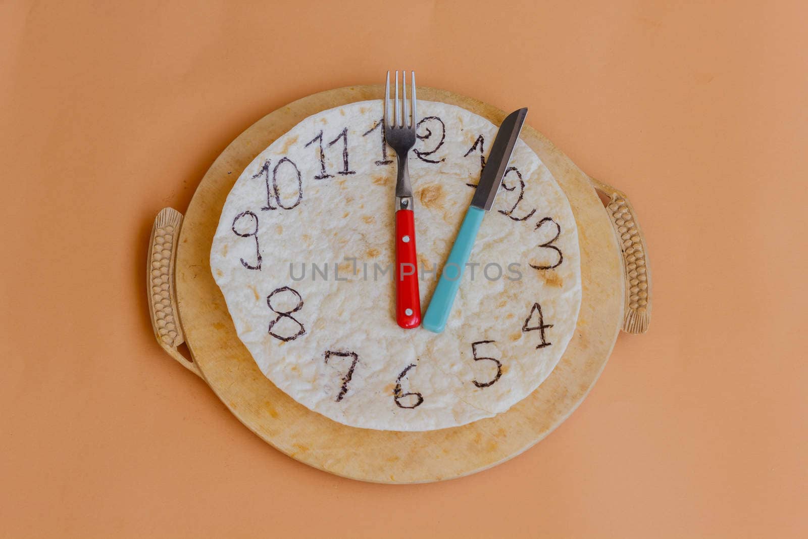 a clock made of piadina marks lunchtime by moorea
