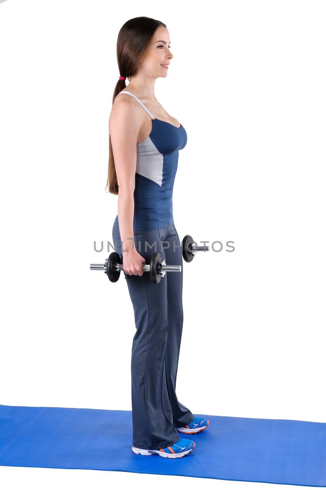 Young woman shows starting position of Standing Dumbbell Squats workout, isolated on white