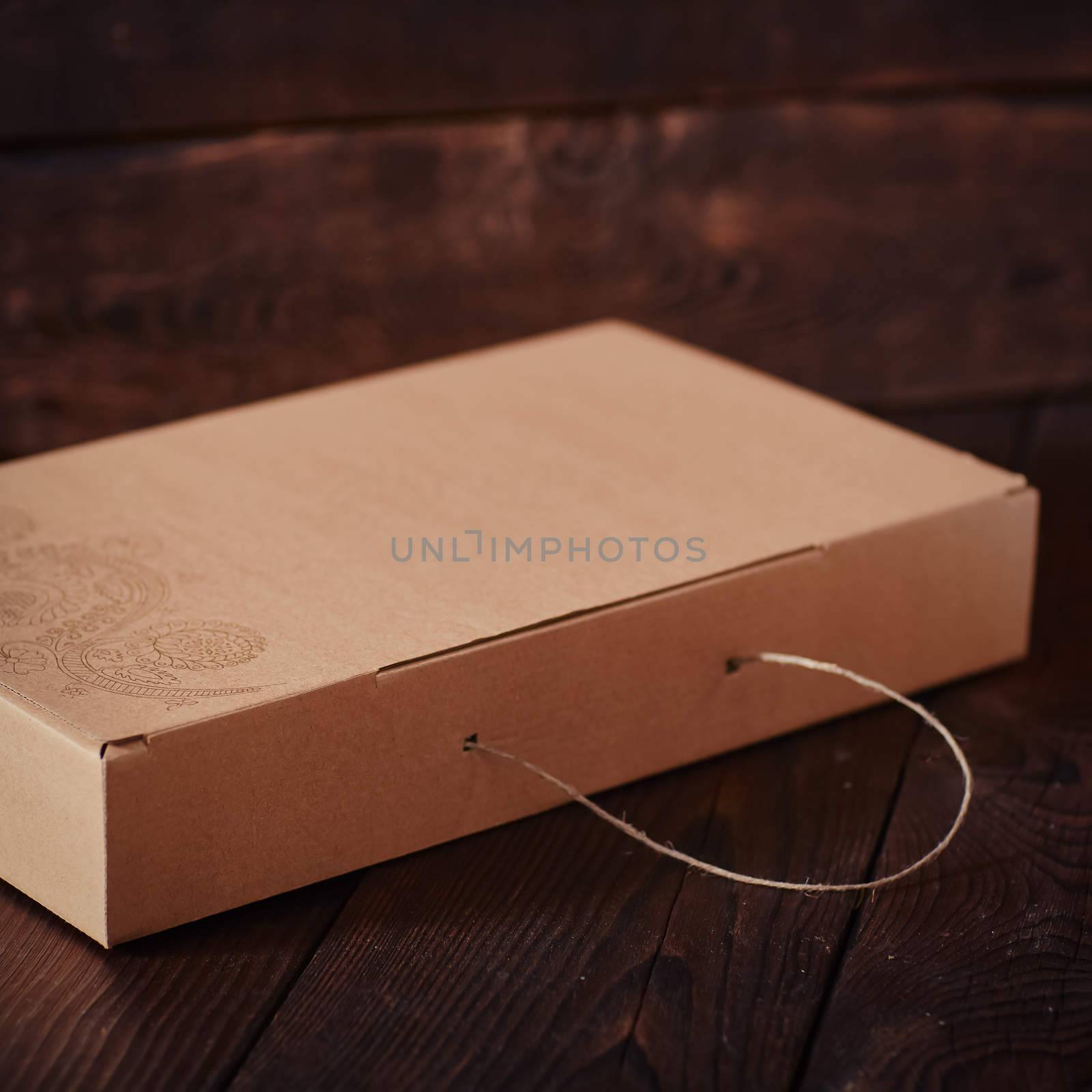 Carton Gift Box on the dark wood background