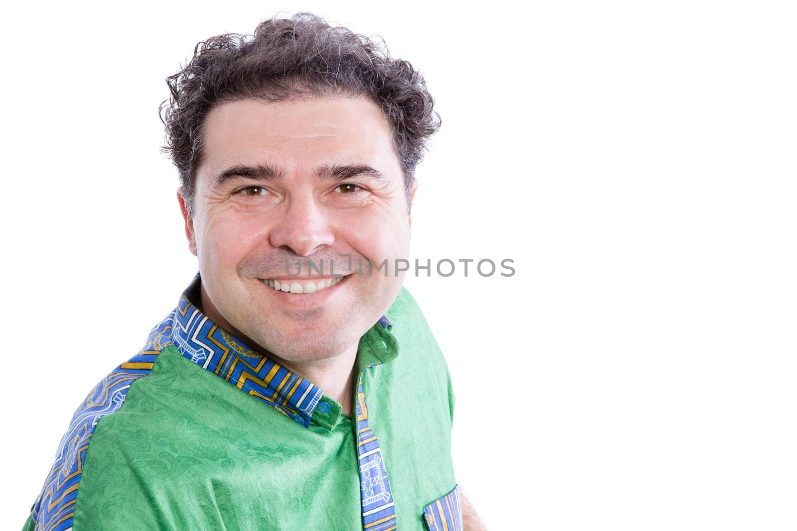 Handsome happy genuine middle-aged man leaning towards the camera with a warm friendly smile, head and shoulders isolated on white with copyspace