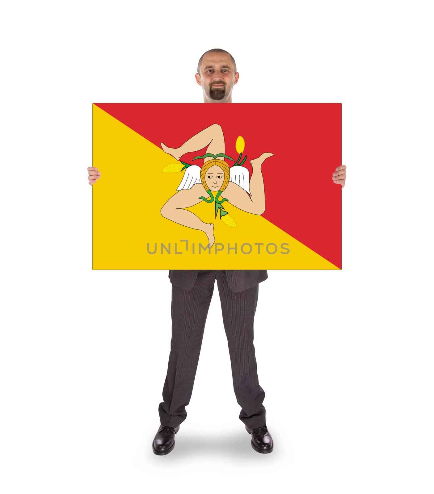 Smiling businessman holding a big card, flag of Sicily, isolated on white