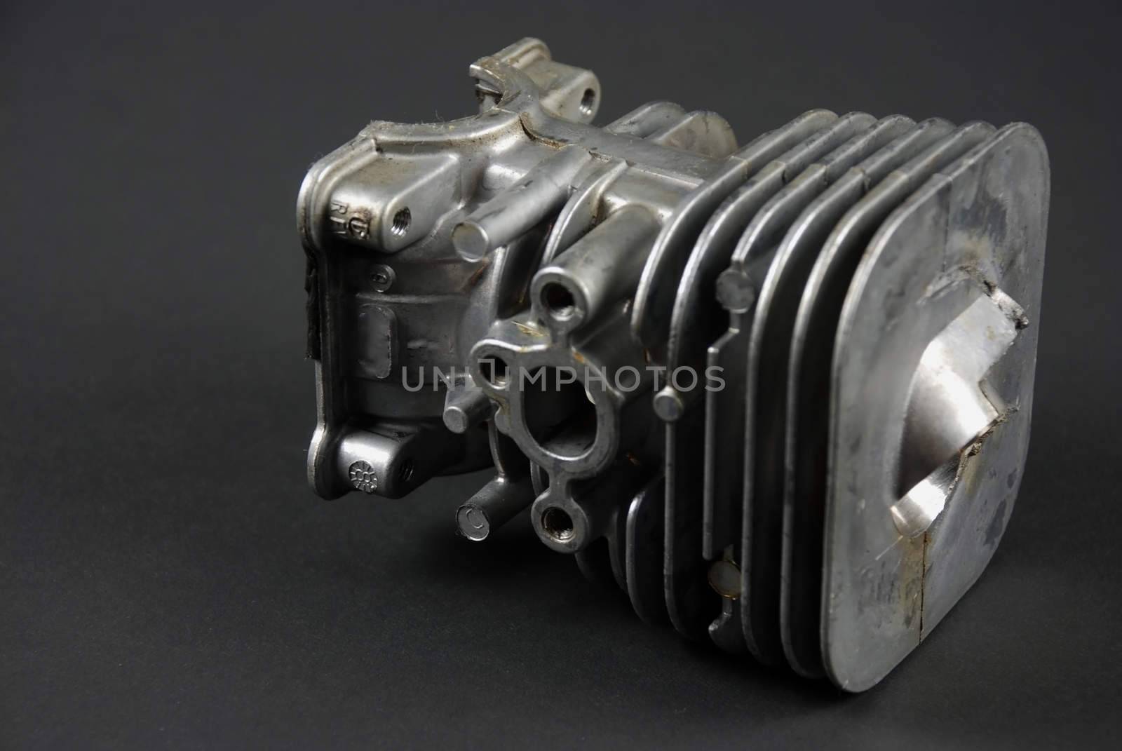 Stock pictures of a small gas engine and a carburetor