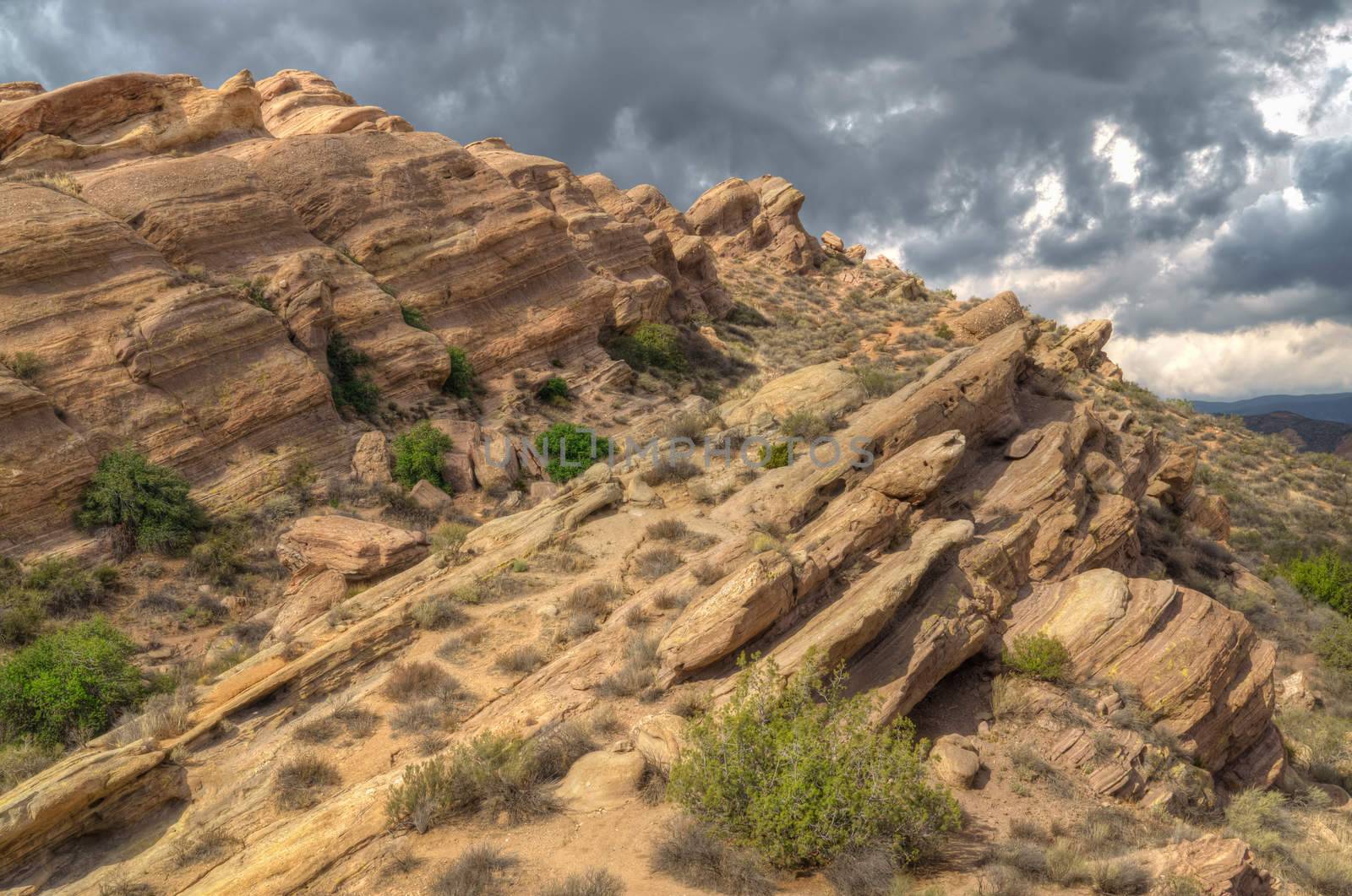 Spectacular formation with dramatic storm sky at Vazquez Rocks in Southern California.