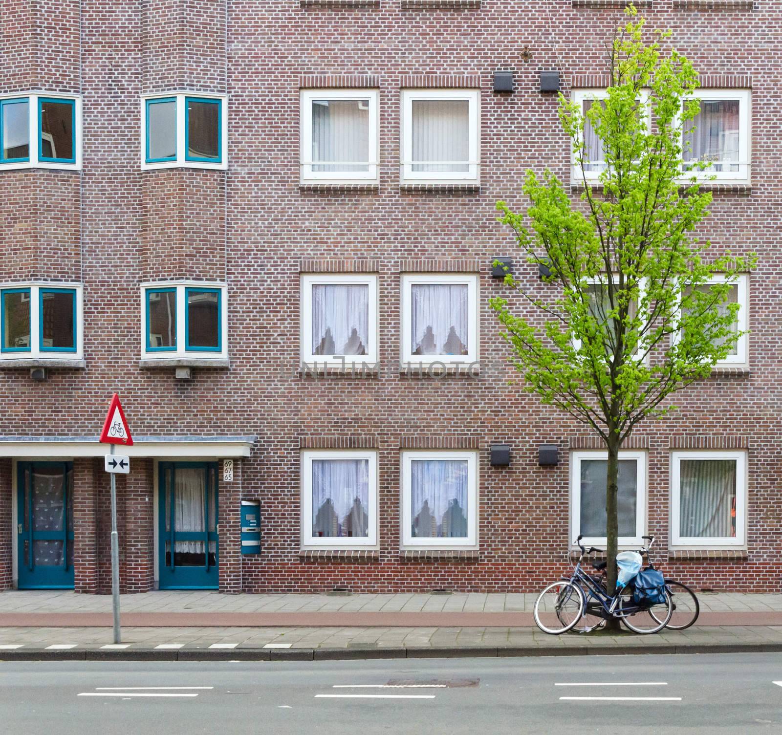 Brick Building in Amsterdam by siraanamwong